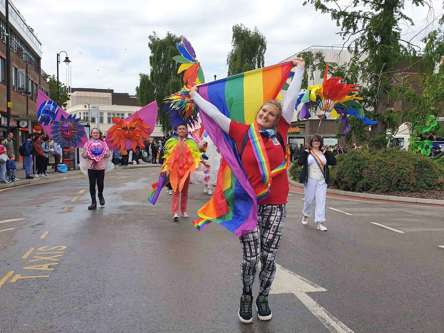 Members of the Pride In Luton and Tokko carnival group in colourful costumes at Luton Carnival 2022