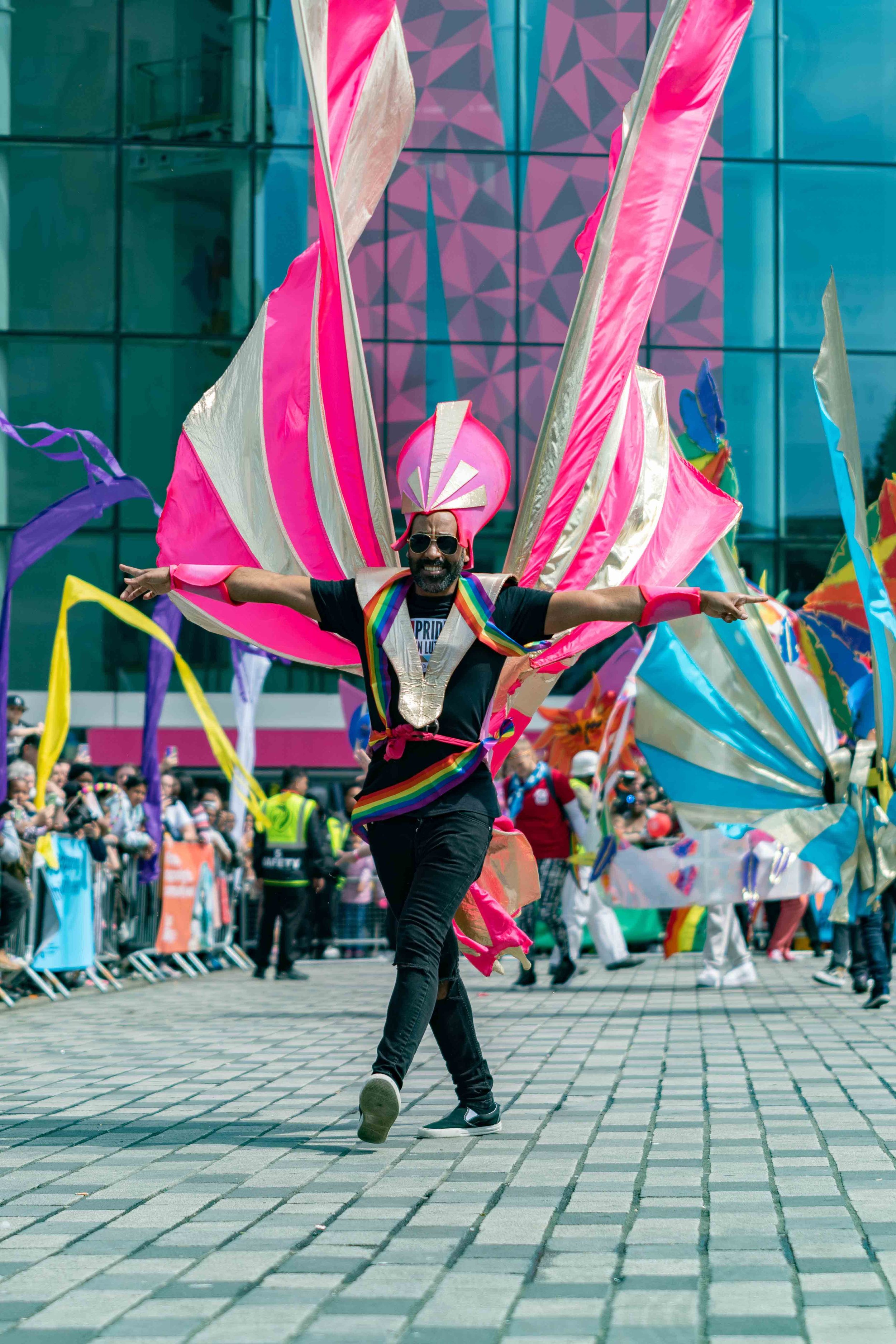 Member of the Pride In Luton and Tokko carnival group in a gravity defying pink and gold costume at Luton Carnival 2022