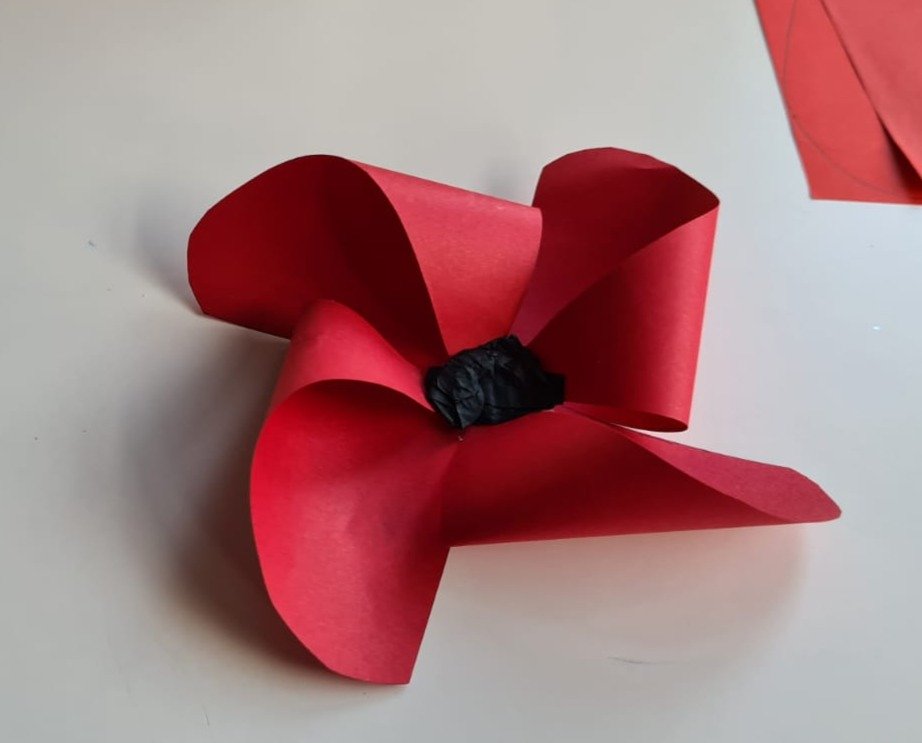 Finished paper poppy with black tissue paper centre