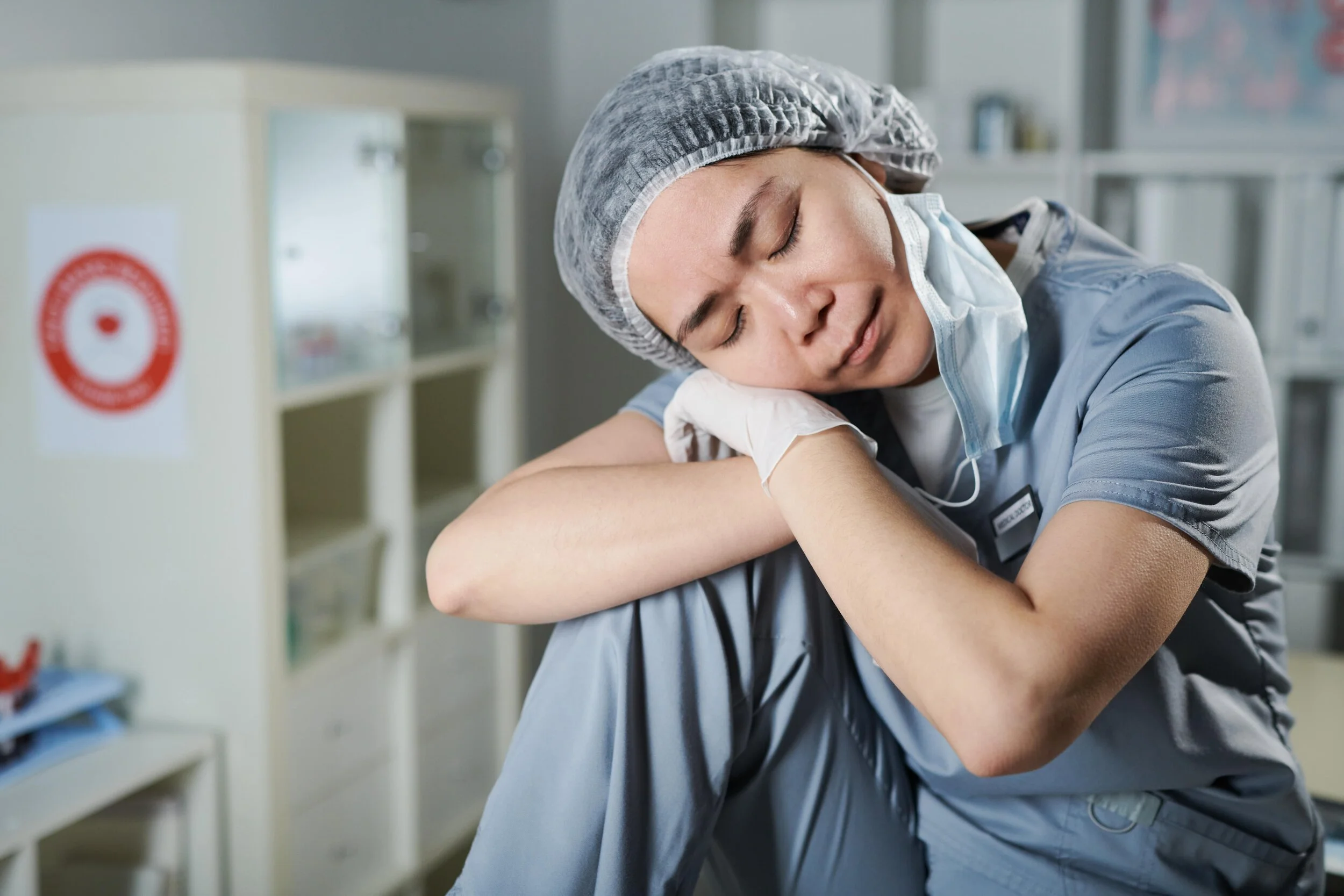 young-tired-asian-nurse-in-uniform-sitting-in-fron-G4V4MS7-min.jpg