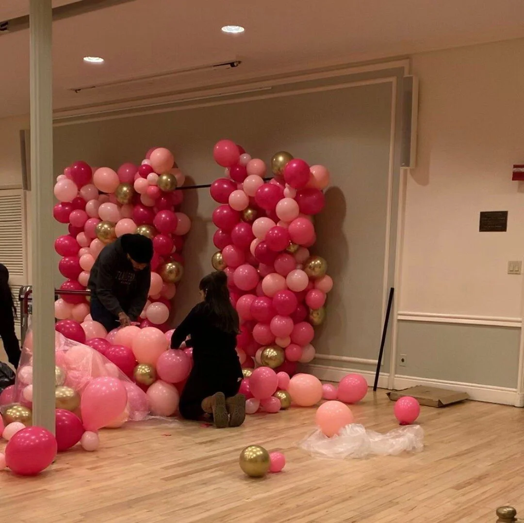 BTS of the team putting together a balloon wall last year!