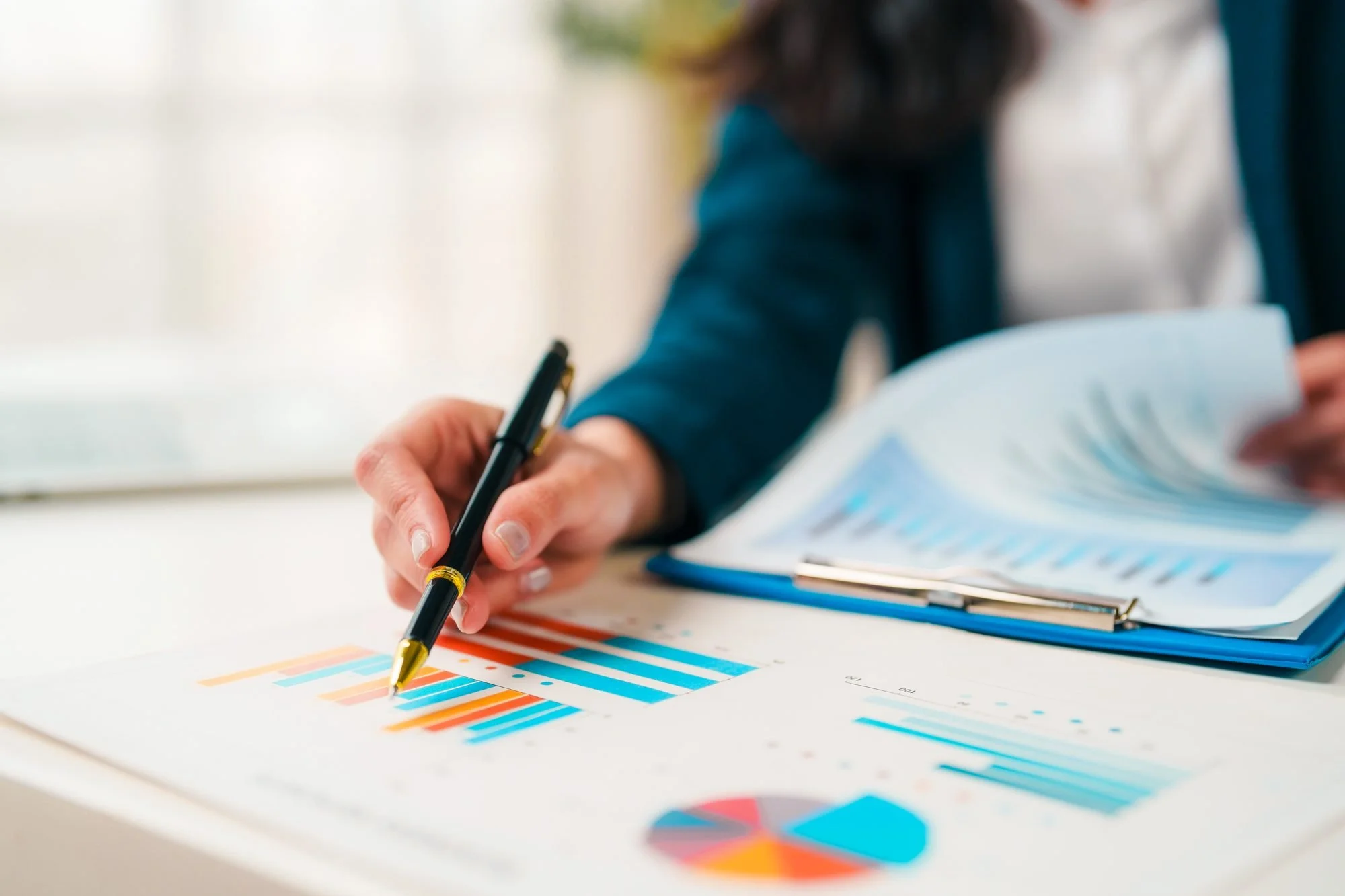 Reviewing financial charts to calculate the cost of employee turnover for middle managers