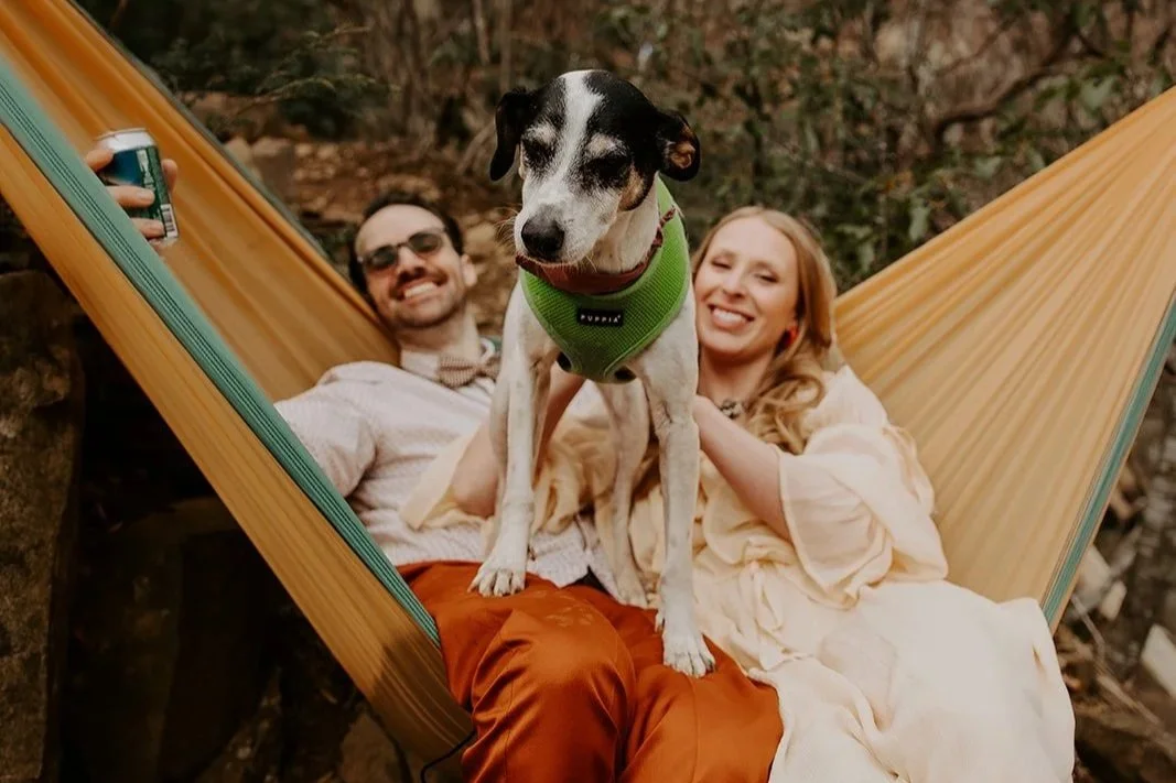 Couple relaxing in a hammock with their dog during an elopement adventure in Shenandoah National Park.