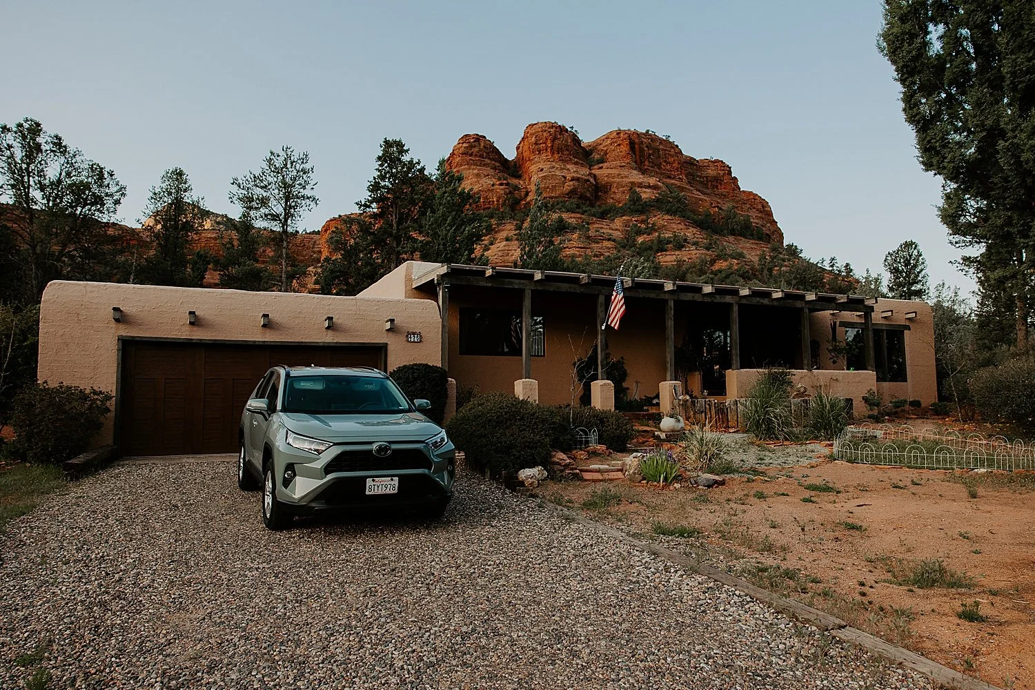Brown stucco airbnb in Sedona with red rock views.