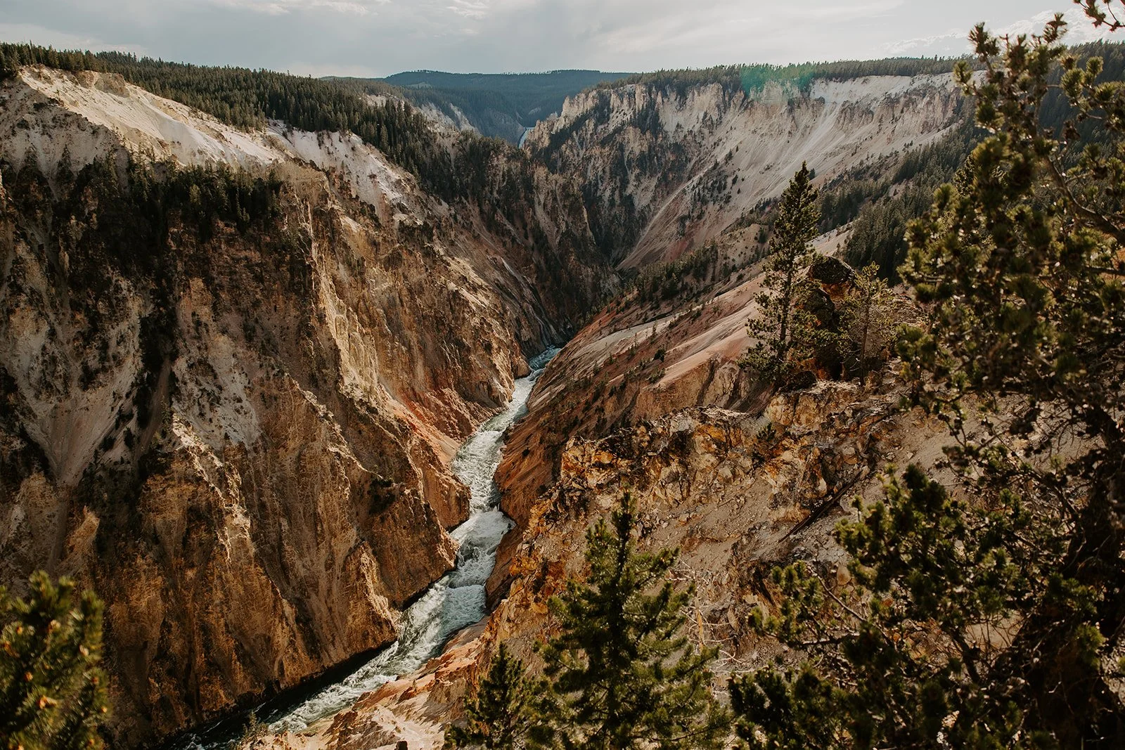 The Yellowstone River carving through the colorful canyon walls of the Grand Canyon of the Yellowstone.