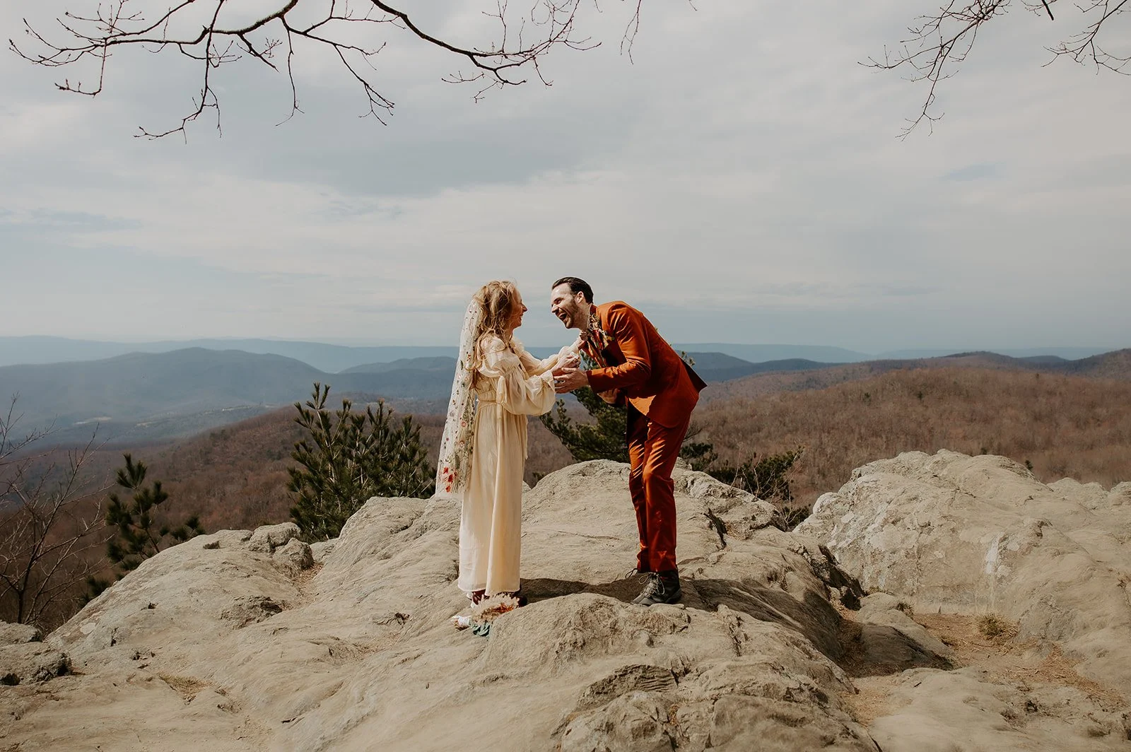 Couple exchanging vows on a mountain overlook during a West Virginia elopement ceremony.