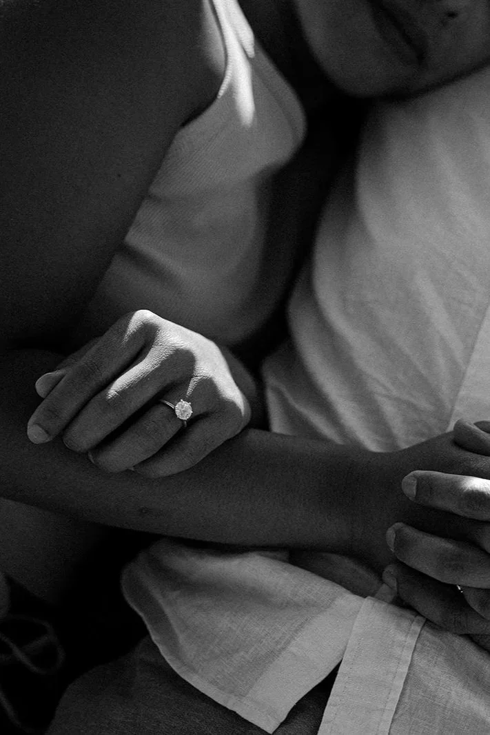 Black and white close-up of engagement ring on a bride’s hand during an intimate elopement moment