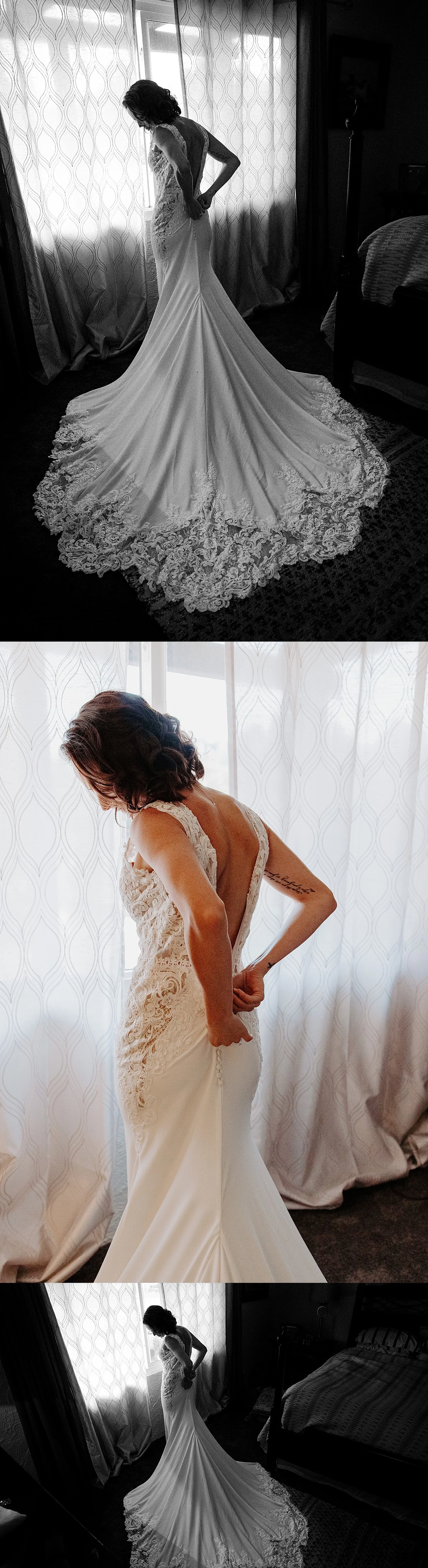 Colleen is standing in front of the window in the master bedroom buttoning up the back of her wedding dress.