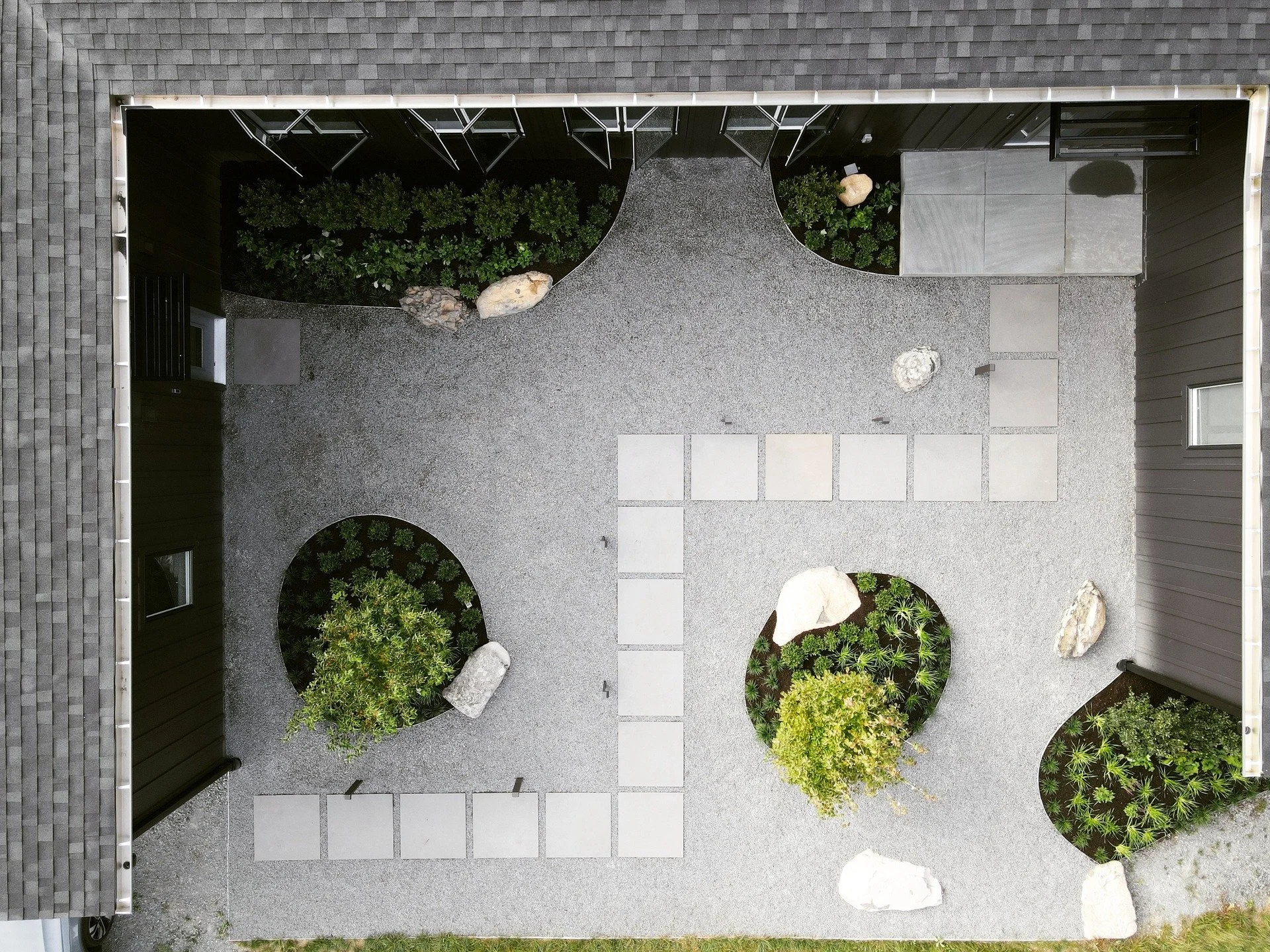 LVF designed this courtyard, part of an artist&rsquo;s retreat in Historic Milford, PA, for one of our favorite clients! Using boulders salvaged from the mountaintop site and locally sourced bluestone, we aimed to keep things grounded and natural. Th