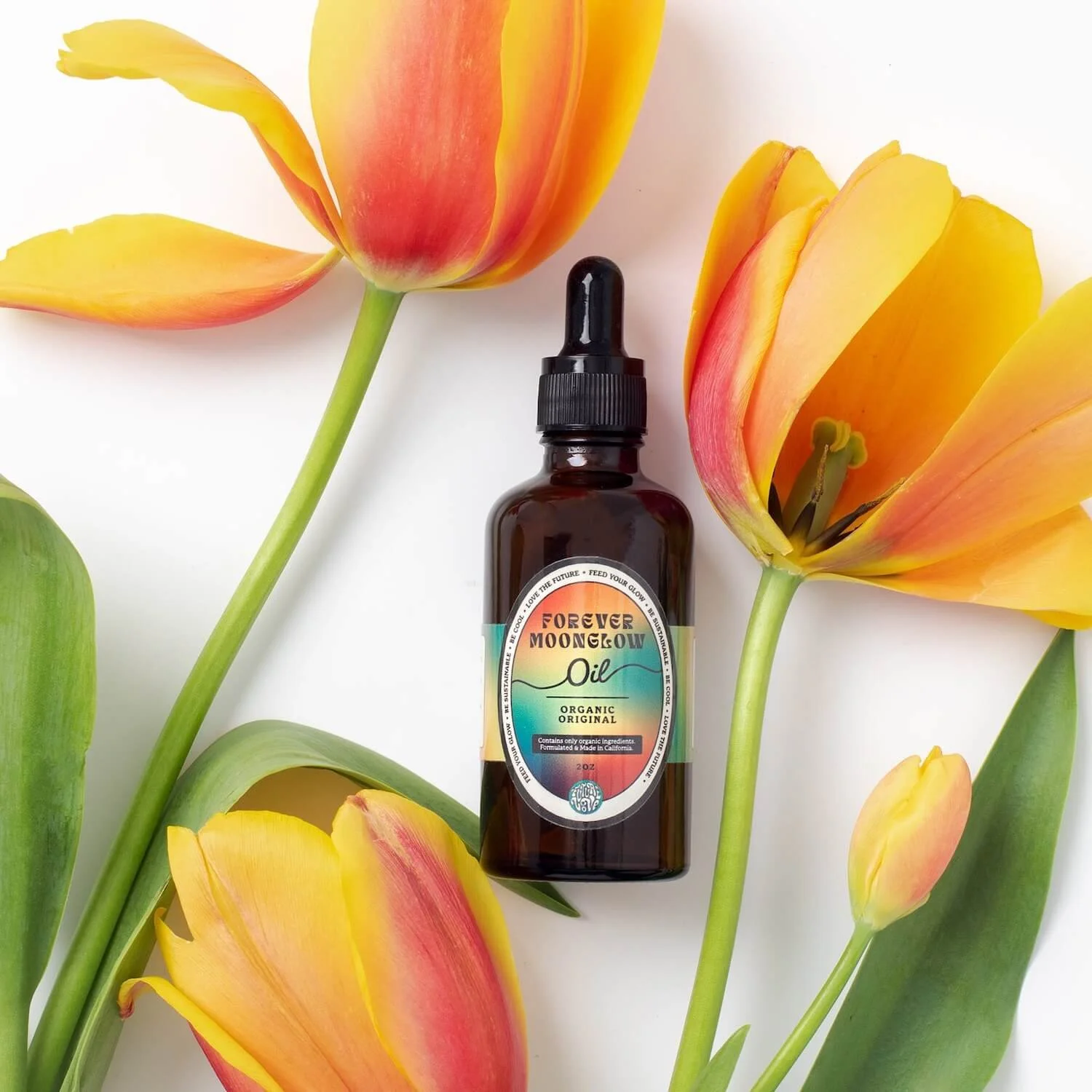 Forever Moonglow Oil label and packaging design for Future Love, styled with orange tulips