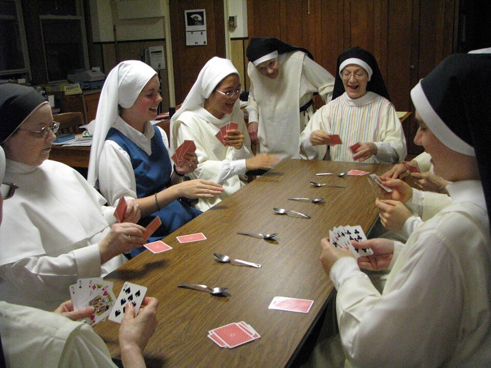 Sr. Mary Ellen Timothy watches a game of spoons at evening recreation