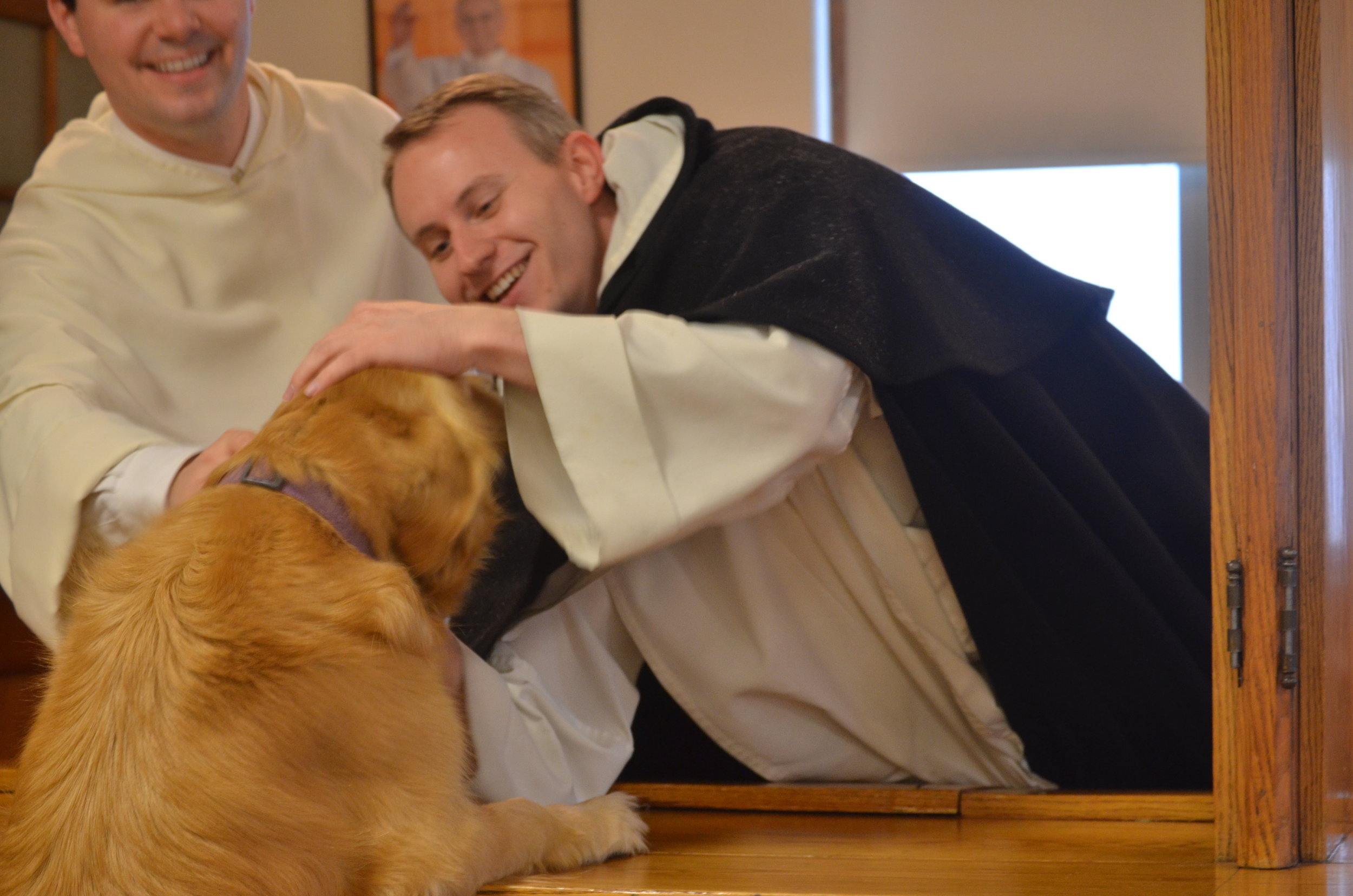 Sabina greets Fr. Patrick (L) & Fr. Philip Neri (R) 