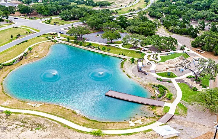 Hill Country residential community with mature oak trees and open green space