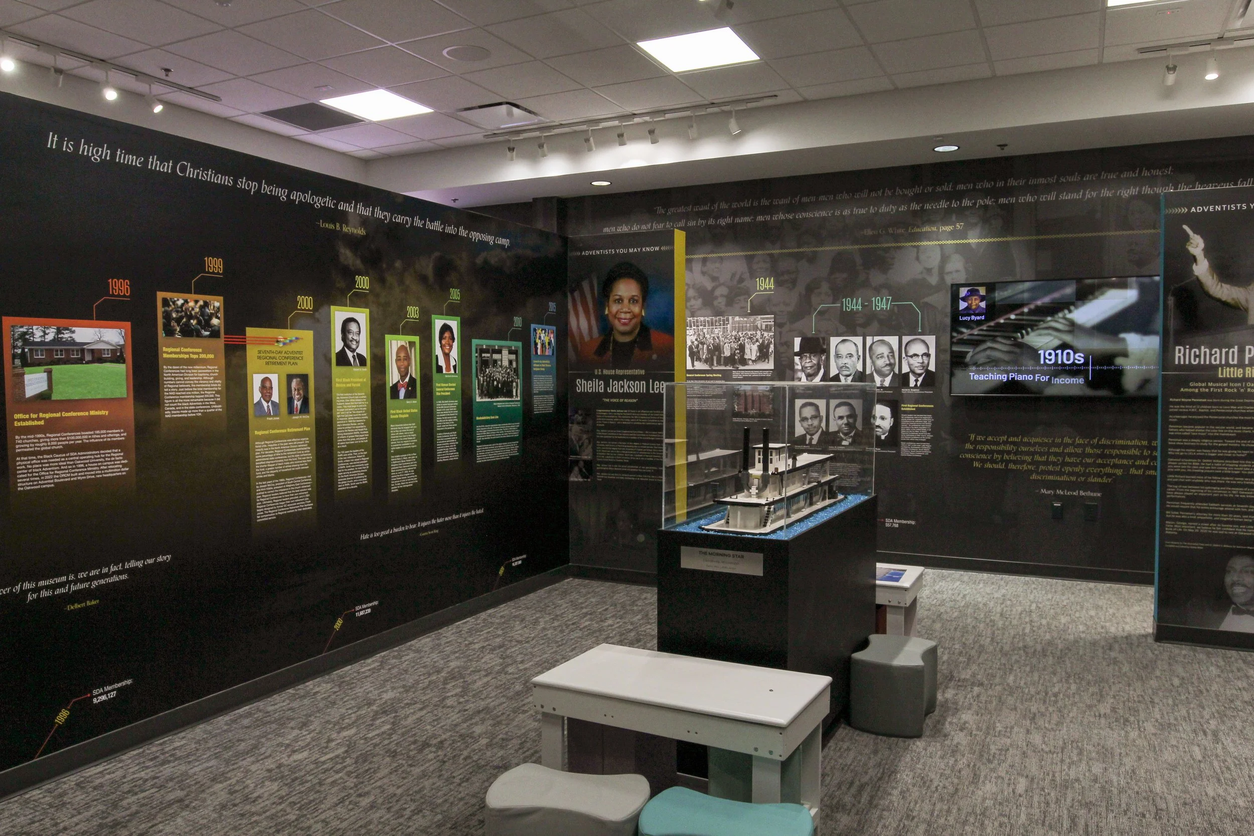 Exhibit wall with a timeline of African American history, featuring photos and quotes, including a model ship display called 'The Morning Star' in a museum setting. Design build by P&C Construction, Inc. - Chattanooga, Tn.