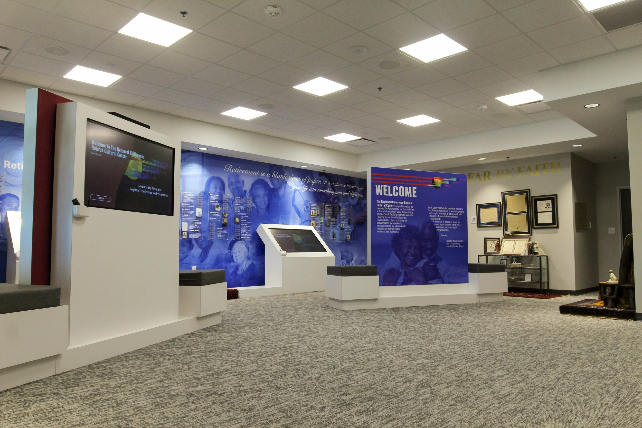 Interior of a community center with informational displays and framed certificates on the wall. Design build completed by  P&C Construction, Inc. - Chattanooga, Tn.