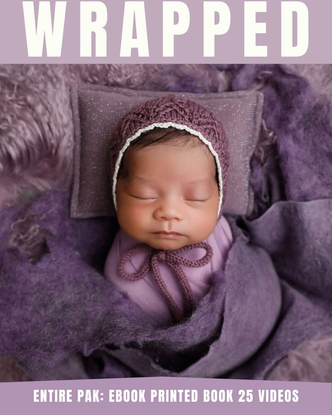 A peaceful sleeping baby wearing a maroon knit hat with a white border, wrapped in purple blankets, lying on a purple pillow with a textured blanket surrounding her.