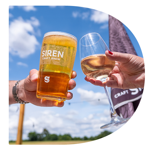 A pint of Siren Craft Brew beer and a glass of Wine, in the garden of the George & Dragon, Swallowfield, being cheersed!
