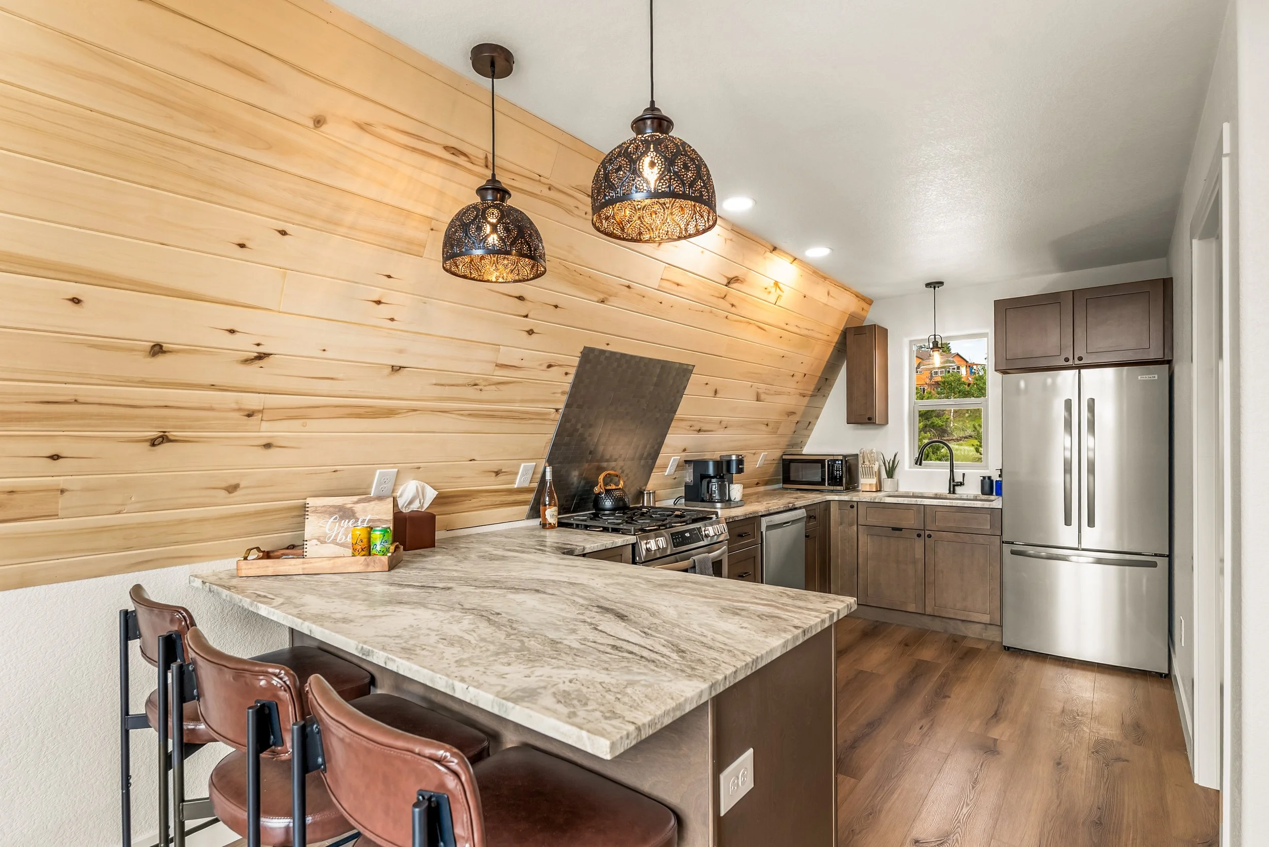Kitchen space that makes it easy to eat prepare food with stainless steel refrigerator