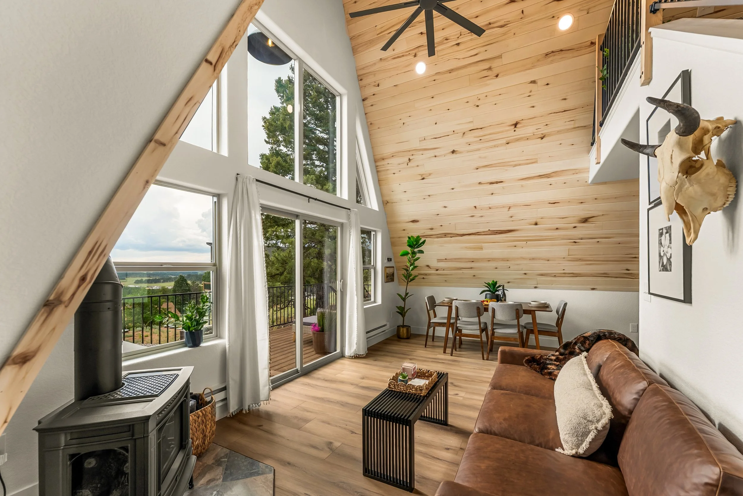 Window wall brings in plenty of natural light and gorgeous mountain views
