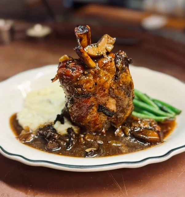 Pork osso buco demi sauce mashed potatoes green beans bordelaise 