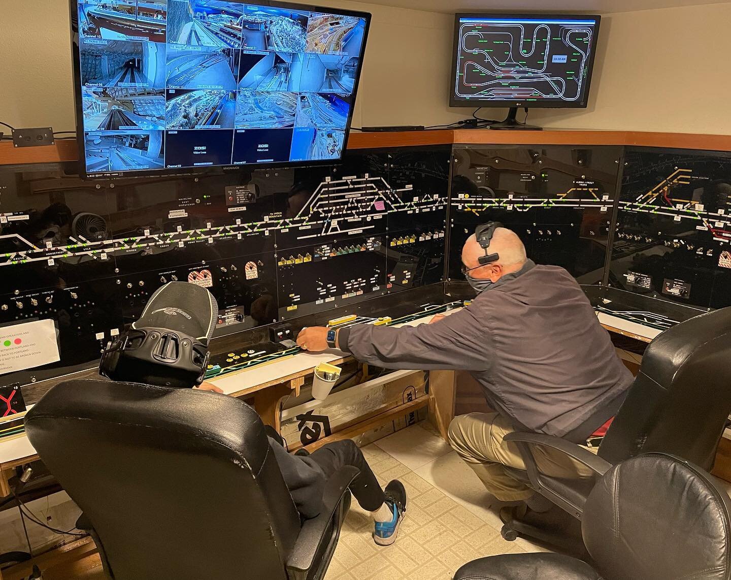 The Columbia Gorge Model Railroad is controlled by two separate dispatchers, who utilize a CTC panel for turnout control, and determine the location of trains using detection (top right) and a network of live streaming cameras (top left). Train opera
