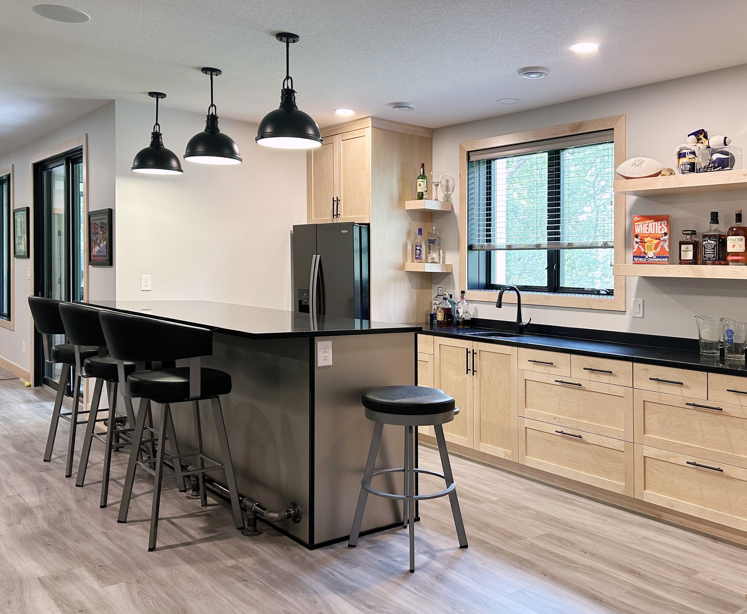 This is the downstairs kitchenette for entertaining guests. The style from the main kitchen continues down into the entertainment area.