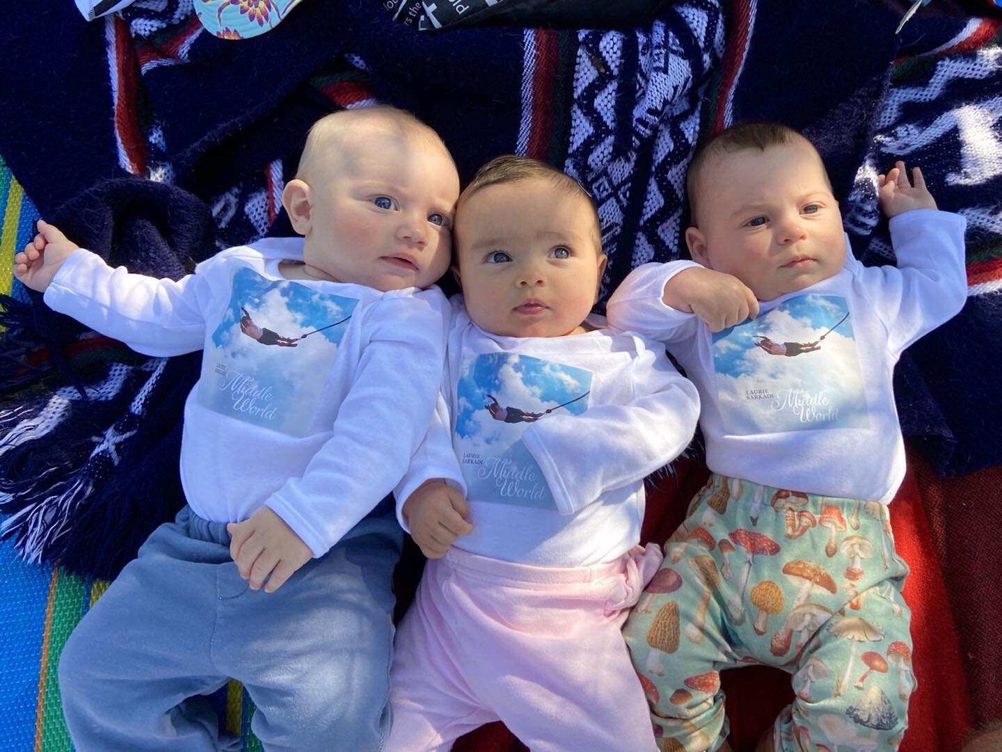 The grandbabies were rocking their #MiddleWorld merch at #Fotr2021. That&rsquo;s their great grandma bungee jumping! #Yellowknife #festival #summertime #livemusic