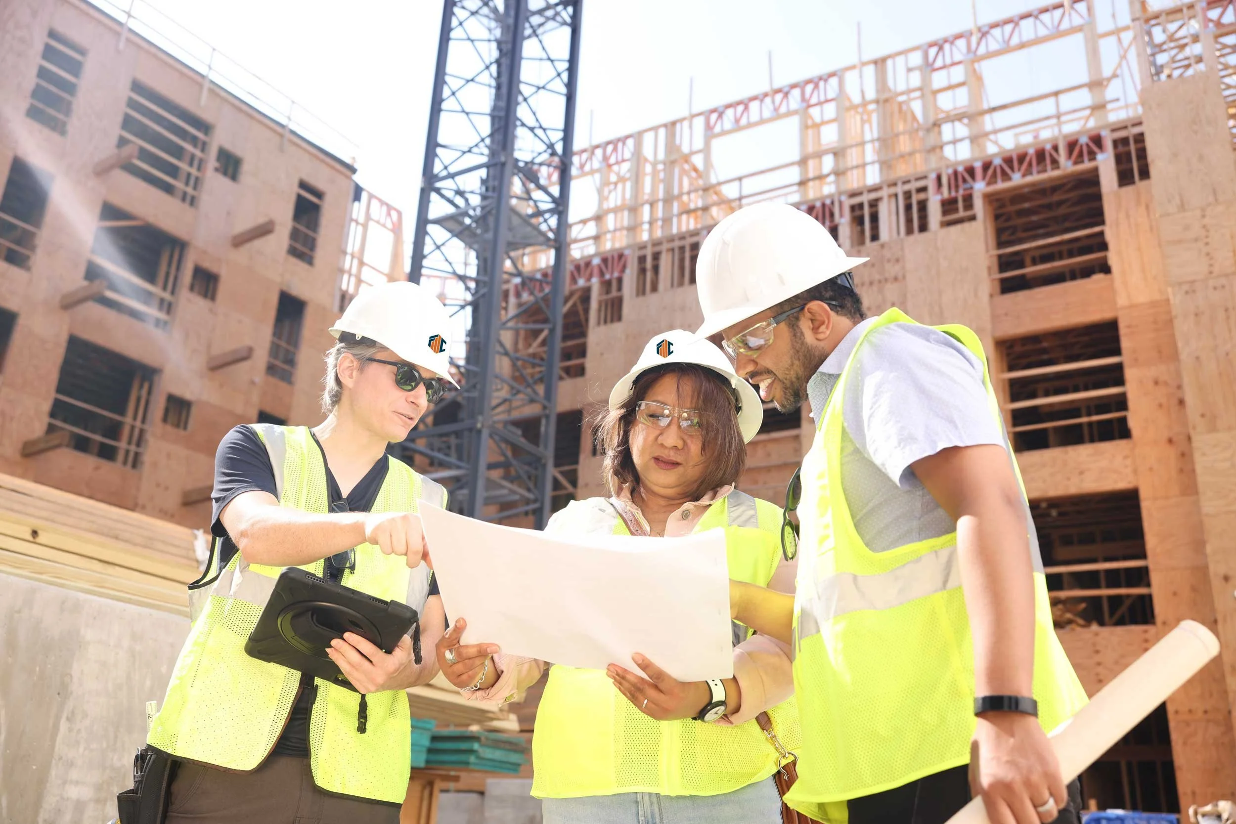 structural engineers on construction site looking at plans