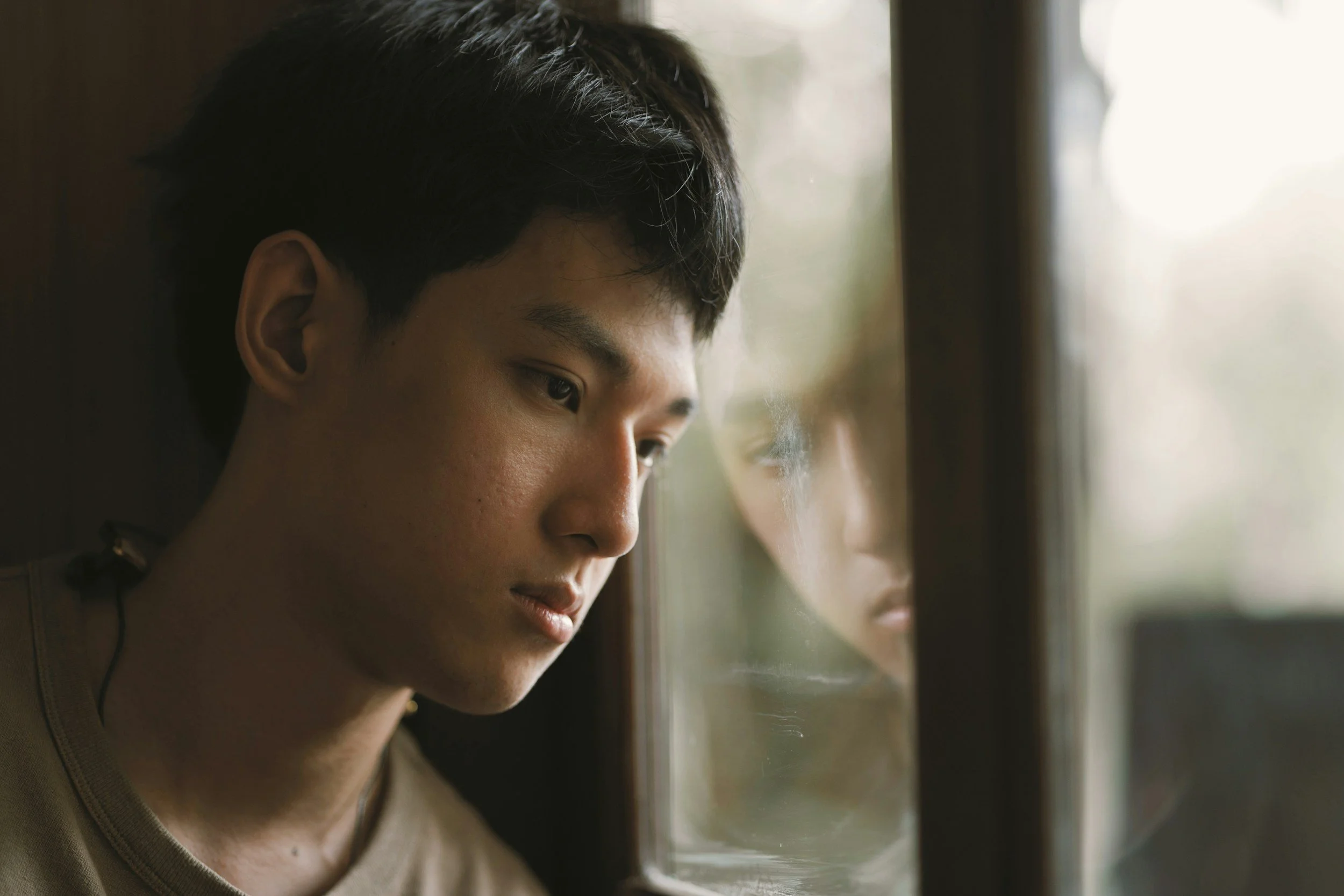 Young man reflecting during an emotional healing and mental health journey