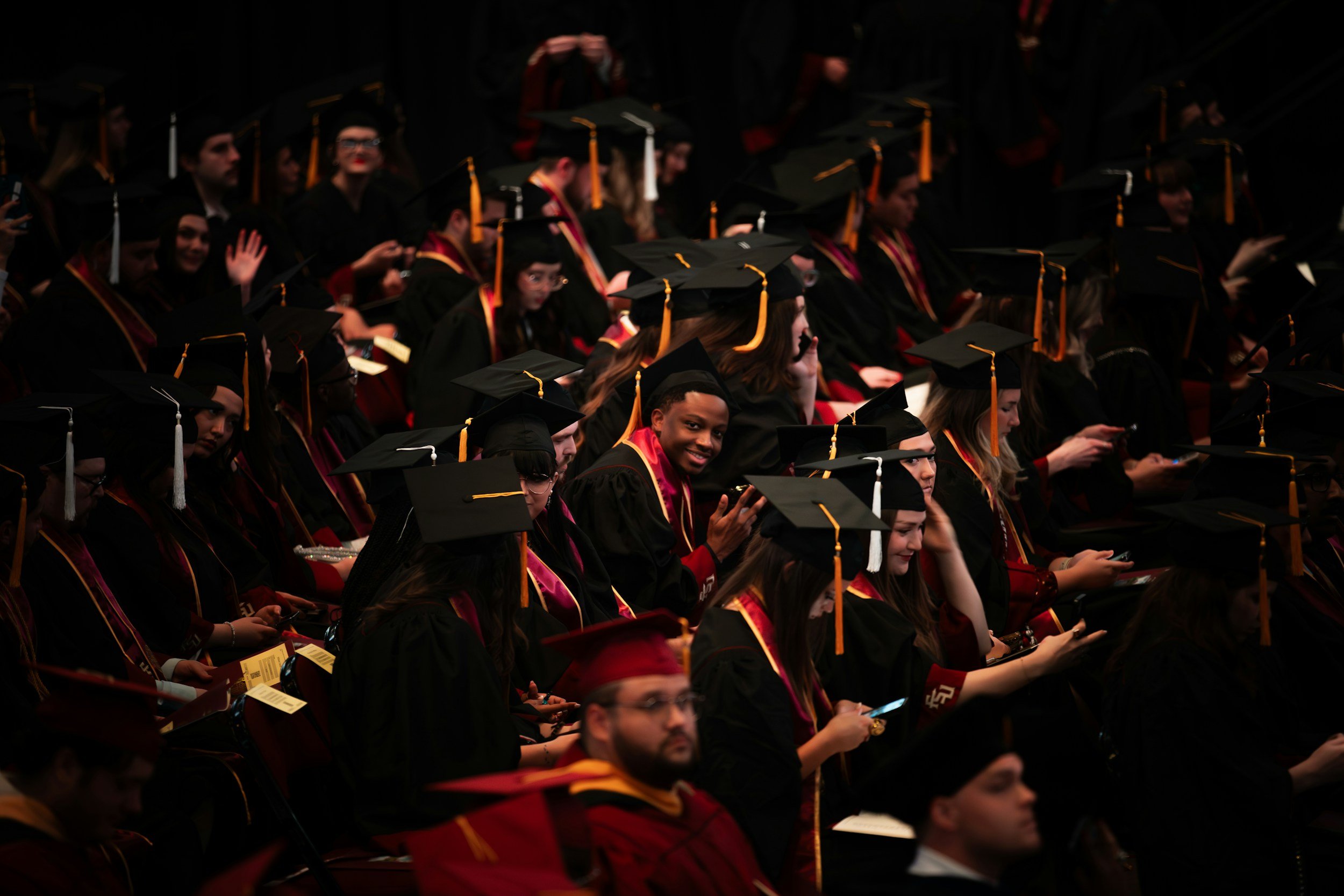 High school graduates celebrating commencement, representing the transition to college, adulthood, and the next stage of life after graduation.