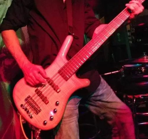 electric bass being played