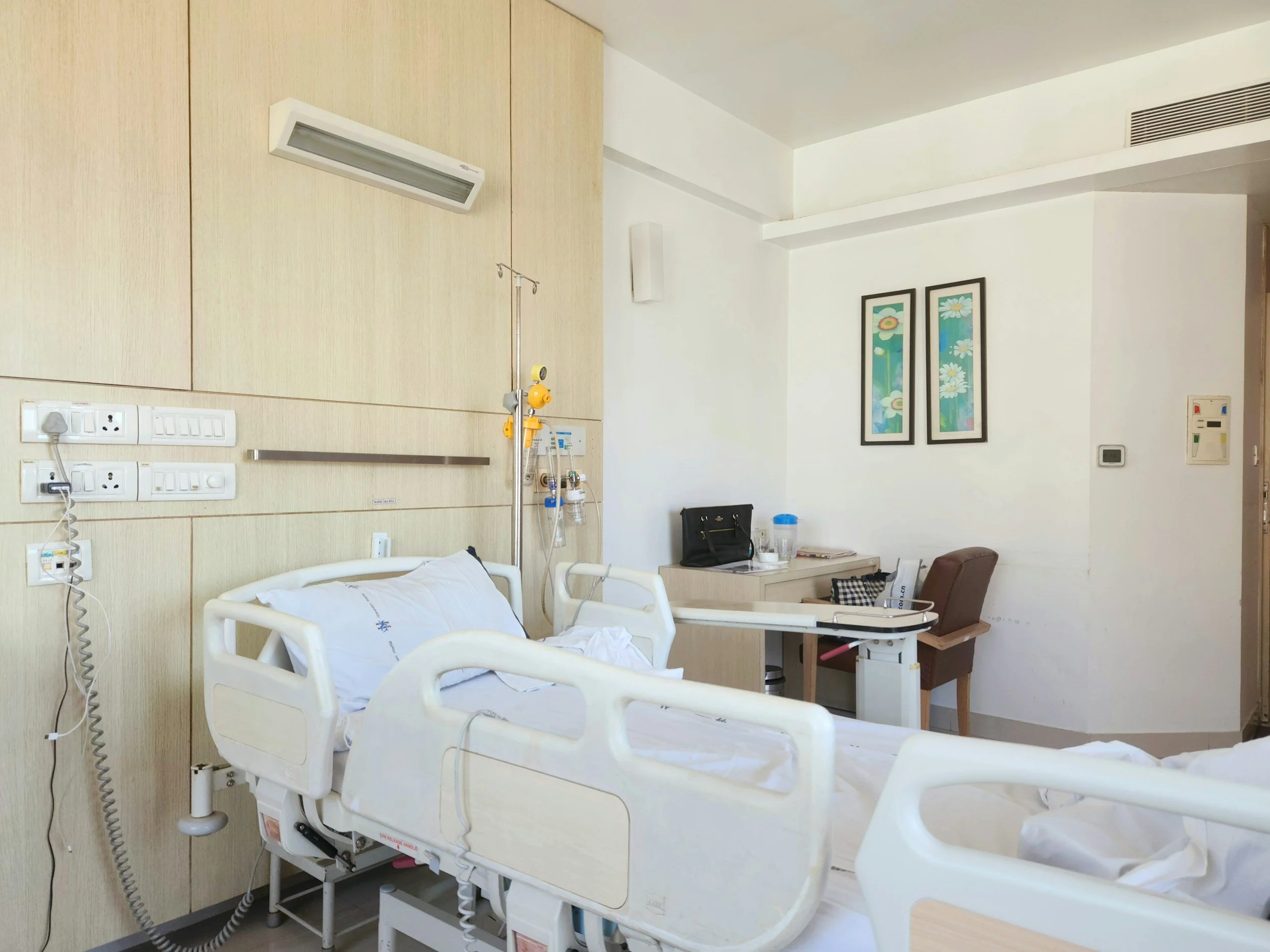 stock image of a hospital interior with hospital bed