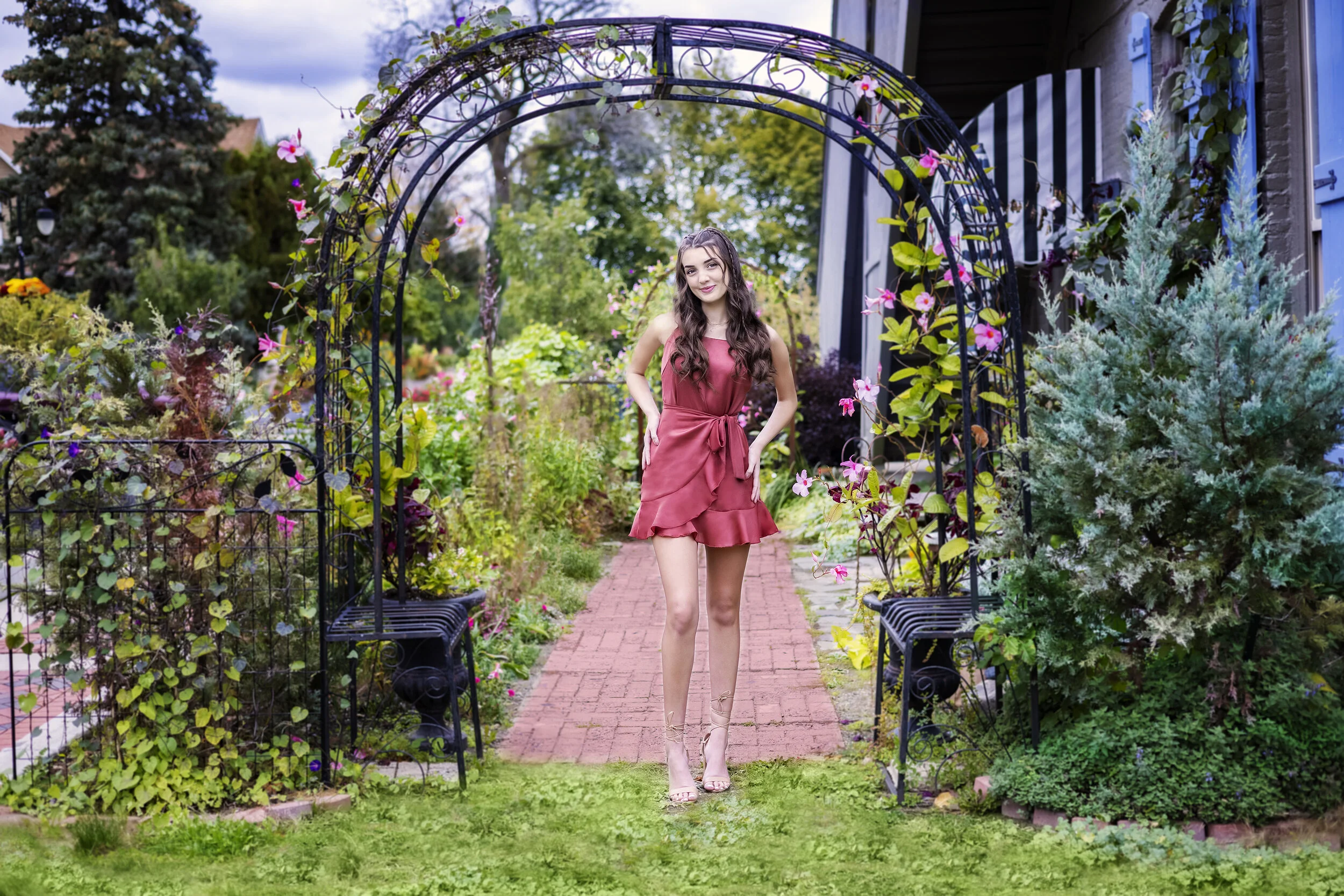 Outdoor senior portrait of a high school senior posing in downtown Fenton, Michigan