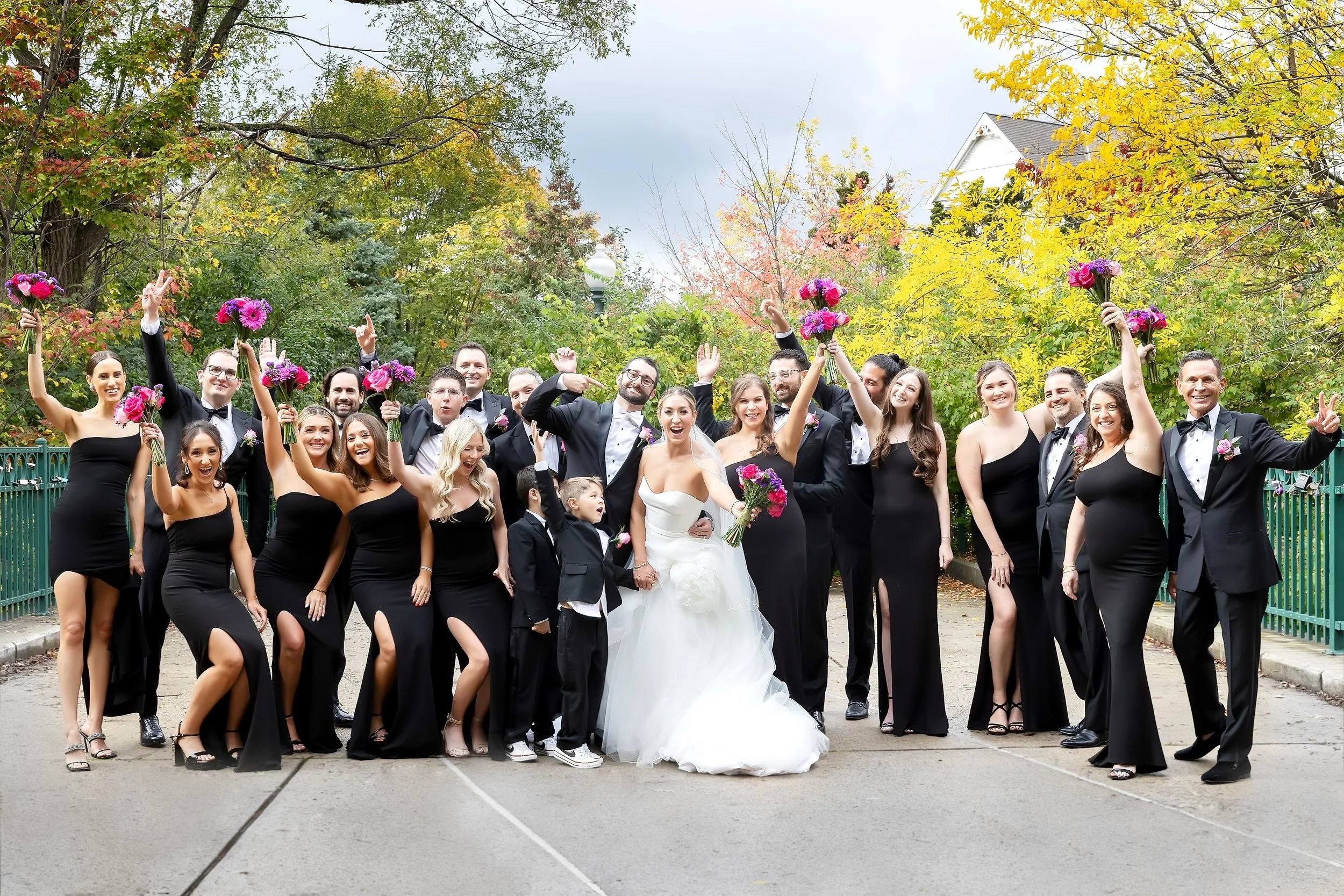 The bridal party cheers at the Royal Park Hotel in Rochester, Michigan