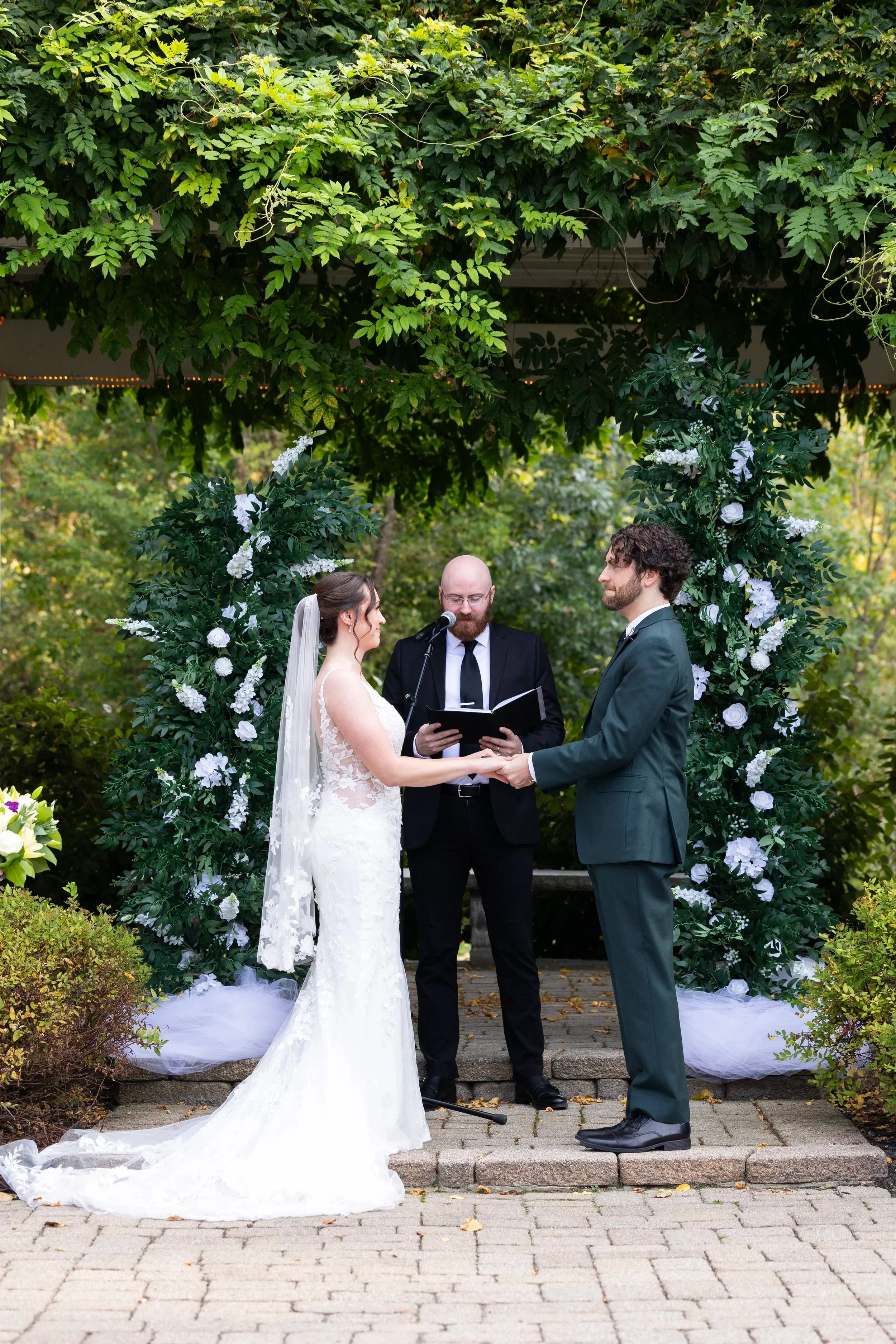 Bride and groom during vows at ceremony at Wellers Weddings in Saline, Michigan
