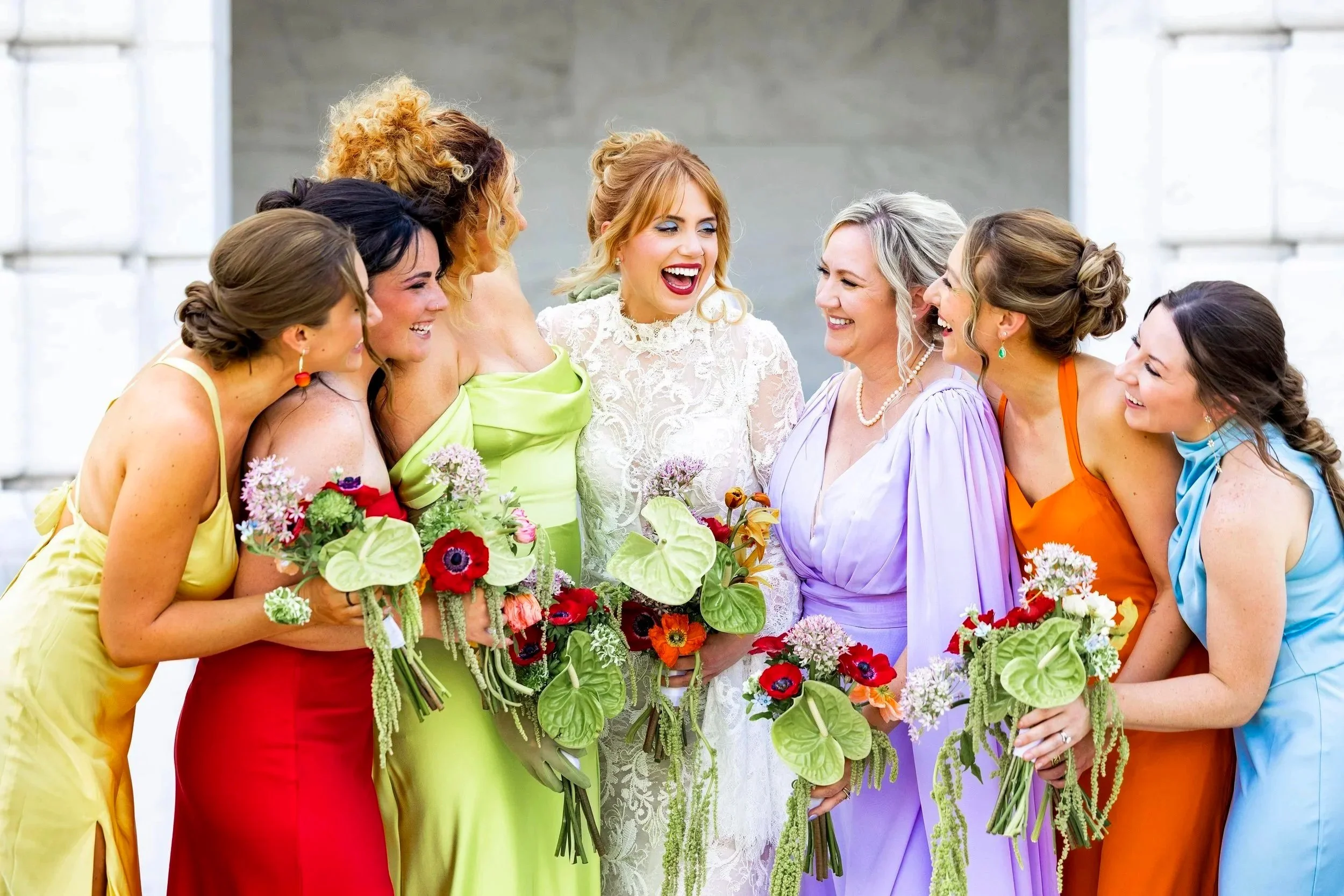 Bride and bridesmaids smiling at Detroit Institute of Arts in Detroit, Michigan