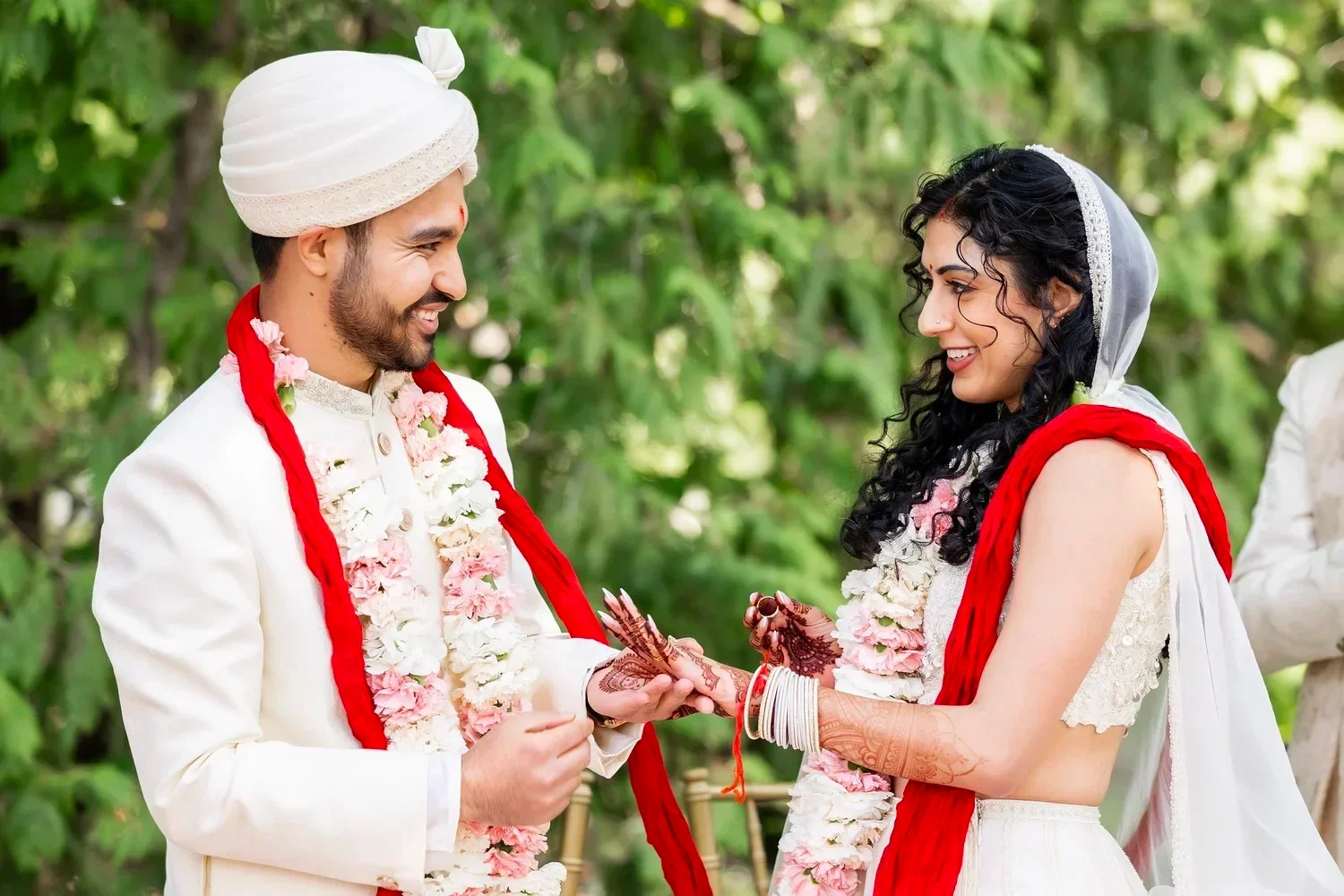 Bride and groom exchanging rings during their Indian wedding ceremony in Ann Arbor, Michigan