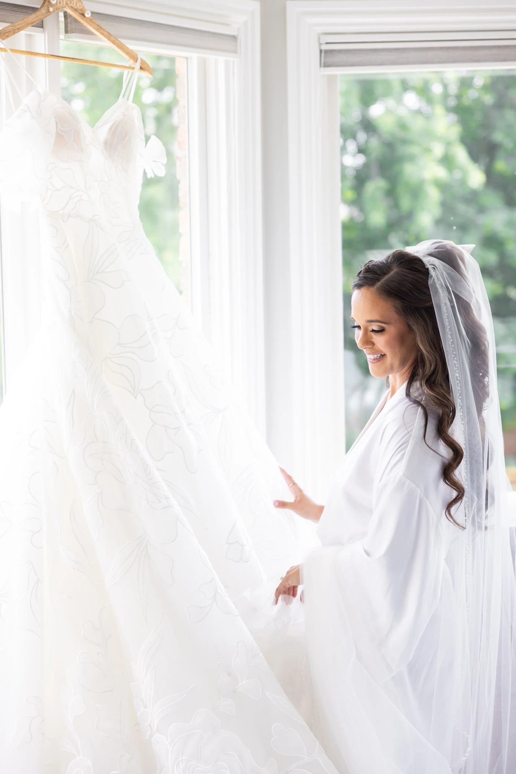 Bride Admiring Luxury Wedding Dress