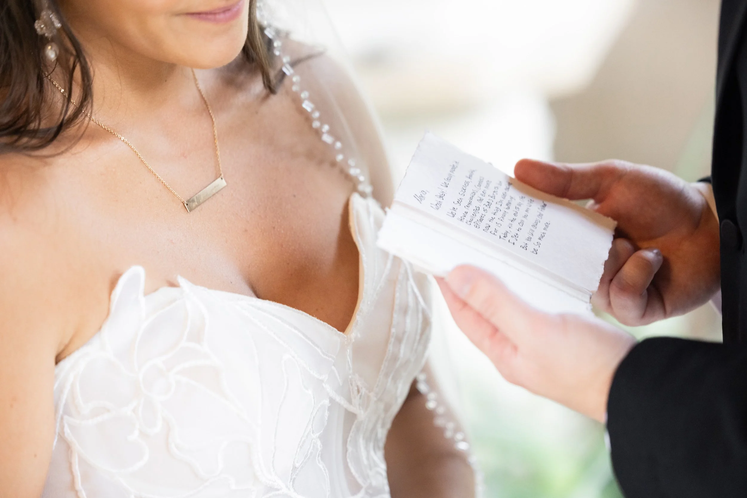 Groom Holding Vow Book