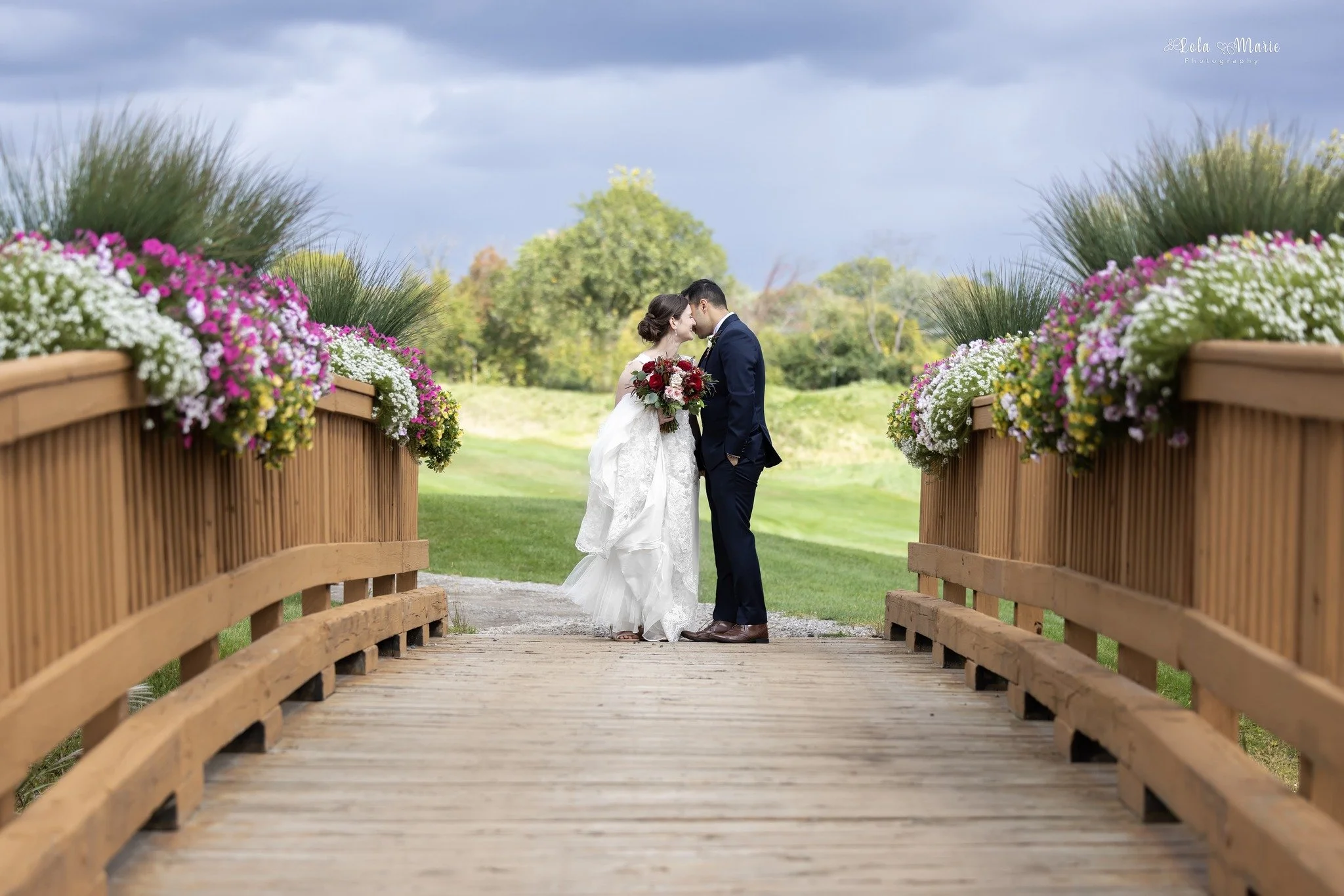 Fox Hills Golf and Banquet Hall wedding photo of bride and groom on bridge on golf course