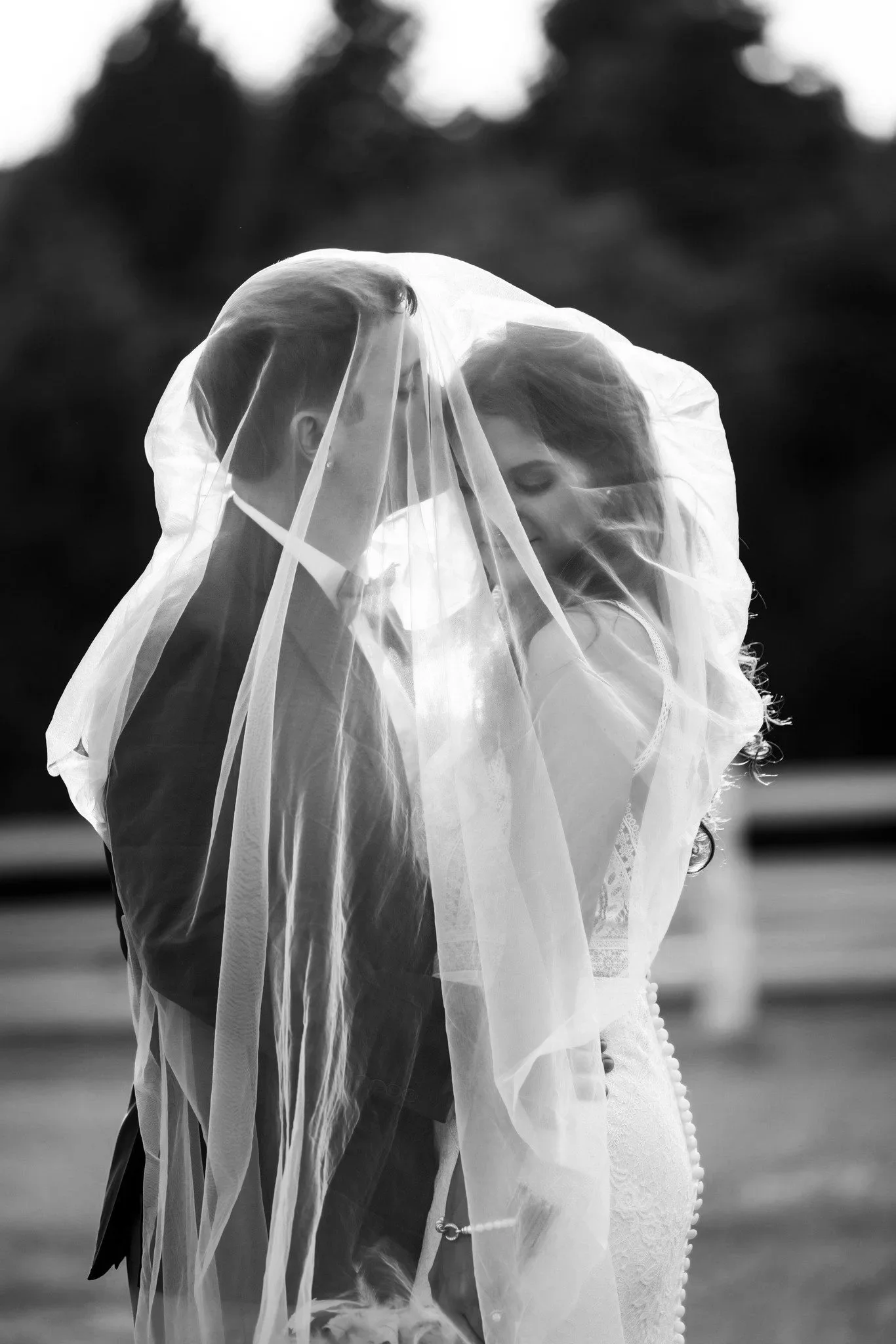 Bride and groom under veil in Ann Arbor, Michigan