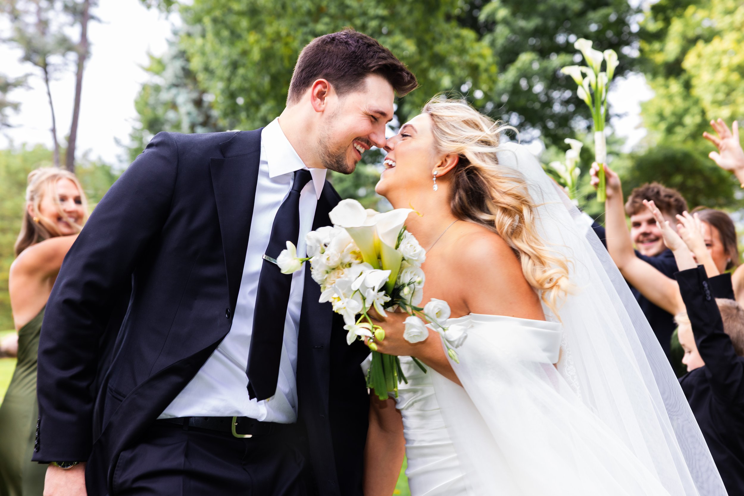 Bride and groom smiling at Pine Knob Mansion in Clarkston, Michigan