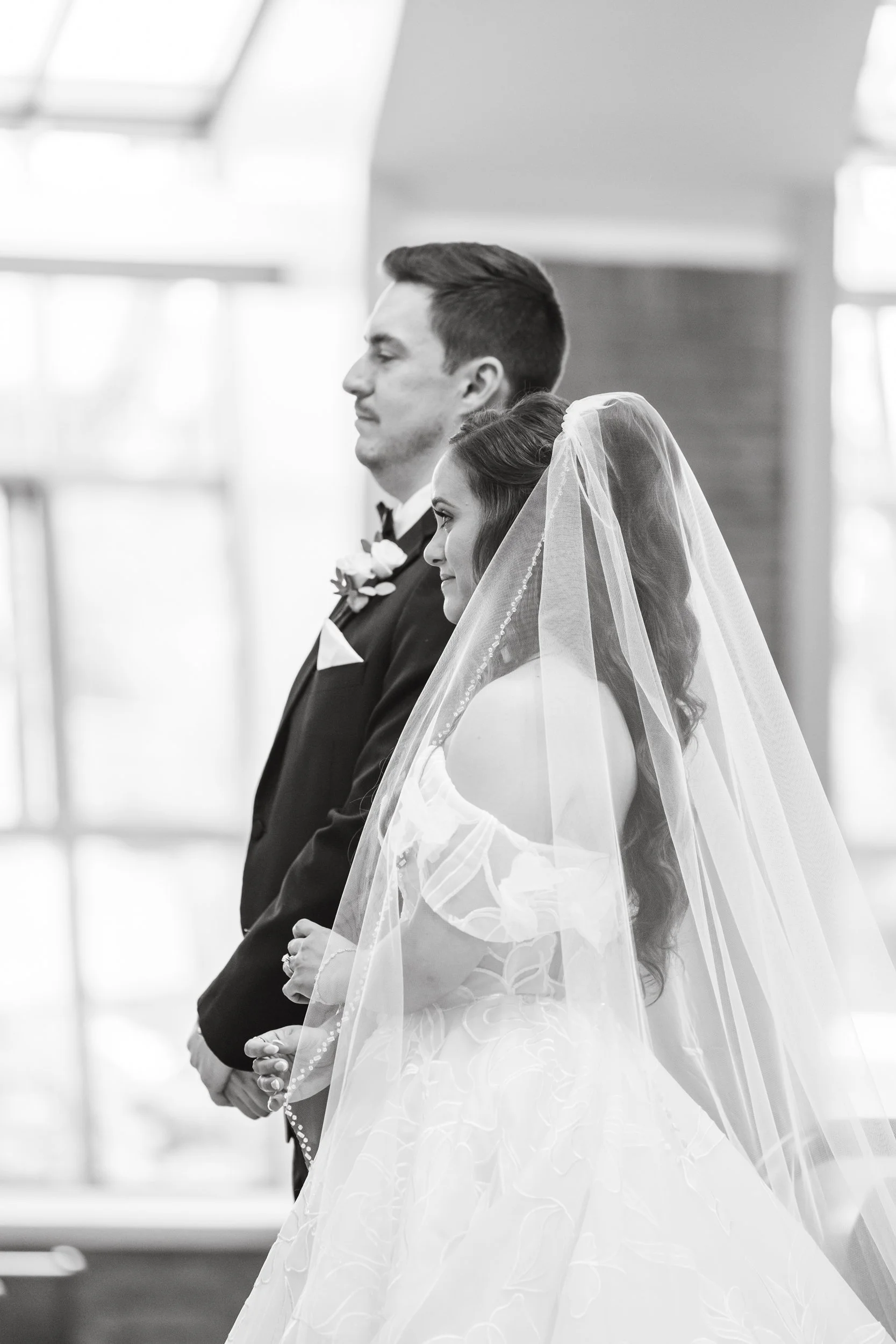 Bride and groom at ceremony in Shelby Twp, MI