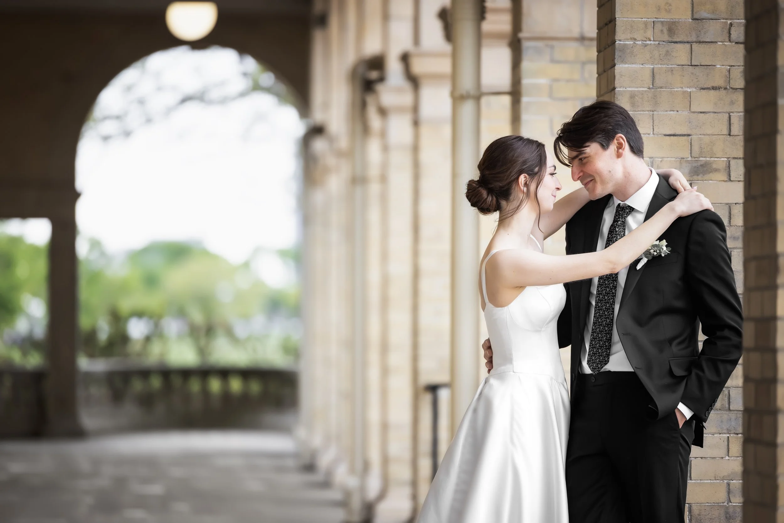 Groom holds bride at Belle Isle Casino in Detroit, Michigan 