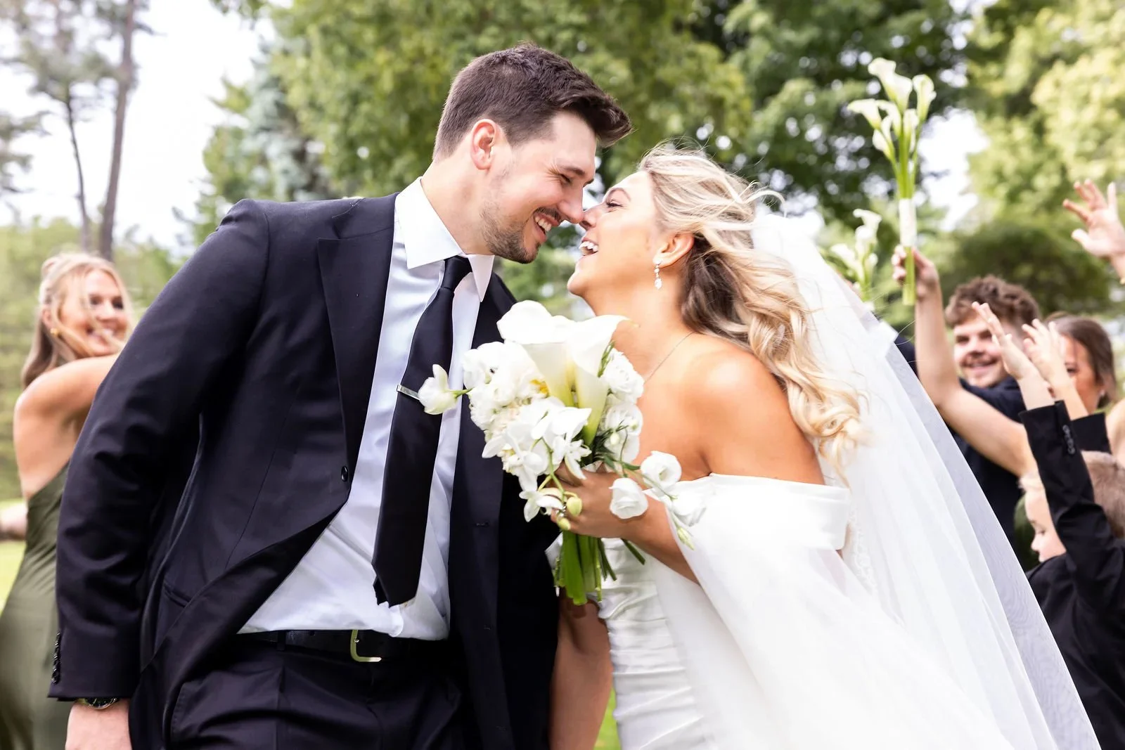 True-to-life color photo of bride and groom smiling big and having fun at Pine Knob Mansion in Clarkston, Michigan