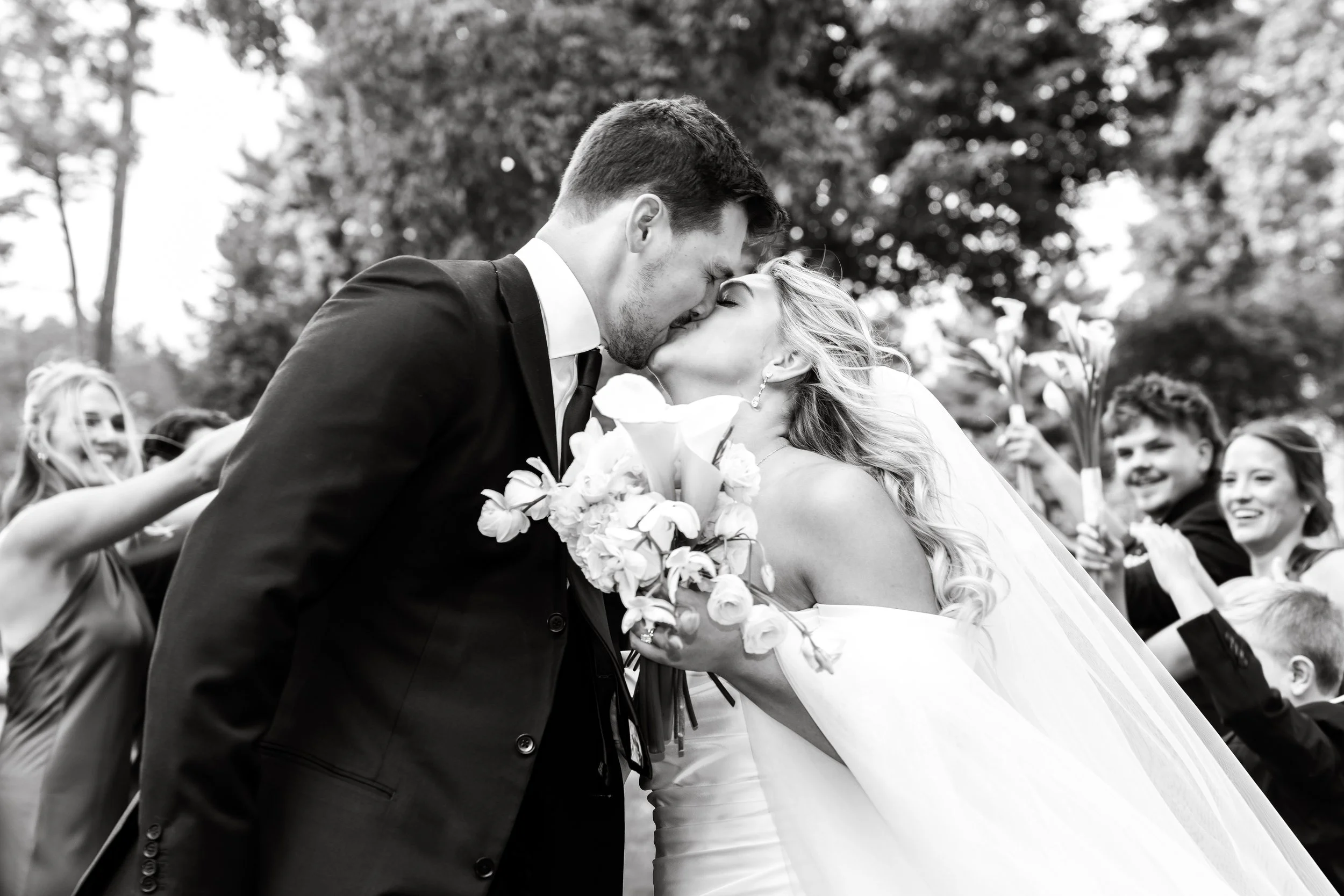 Bride and groom kiss at Pine Knob in Clarkston, Michigan