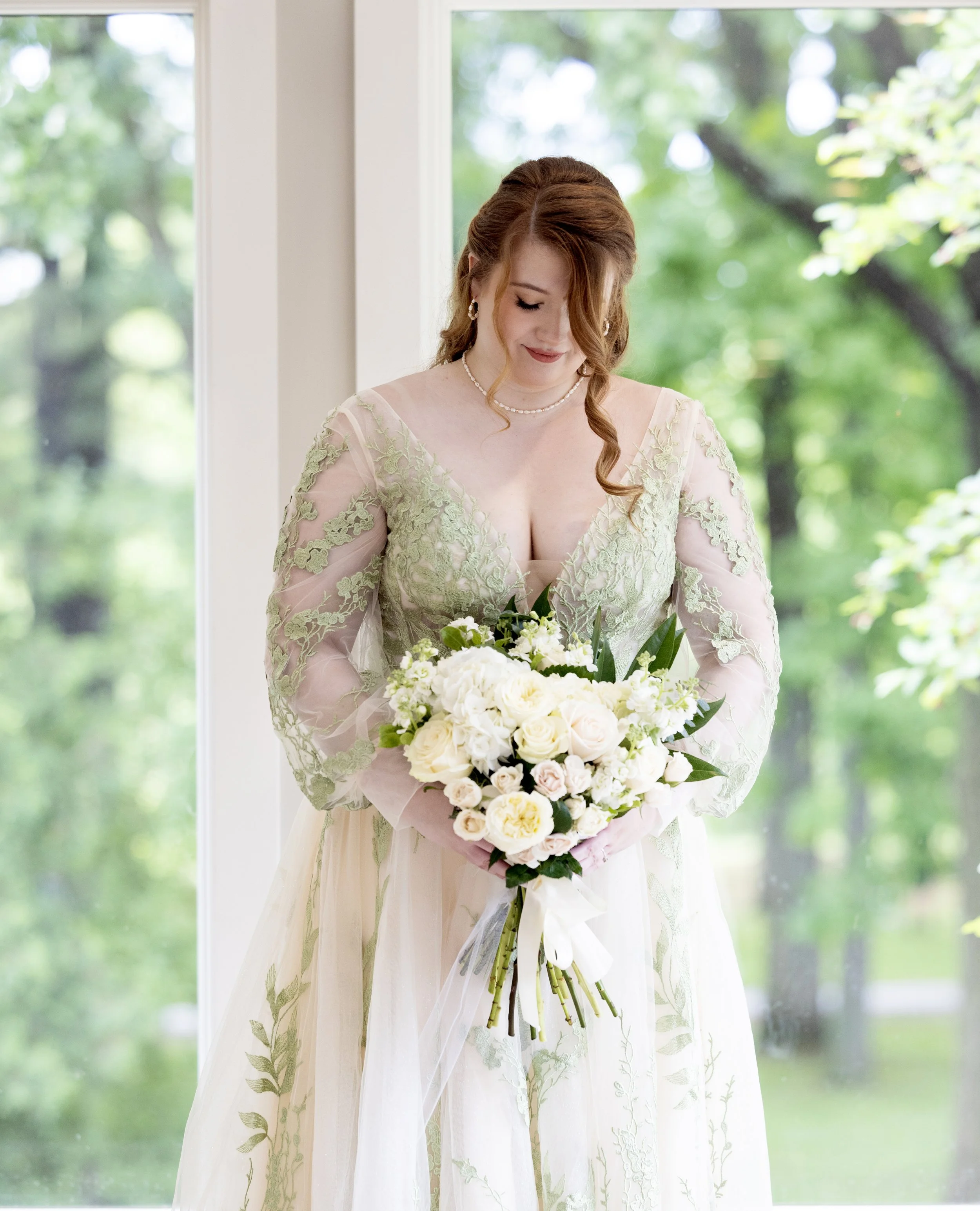 beautiful and romantic bridal portrait near window in rochester michigan