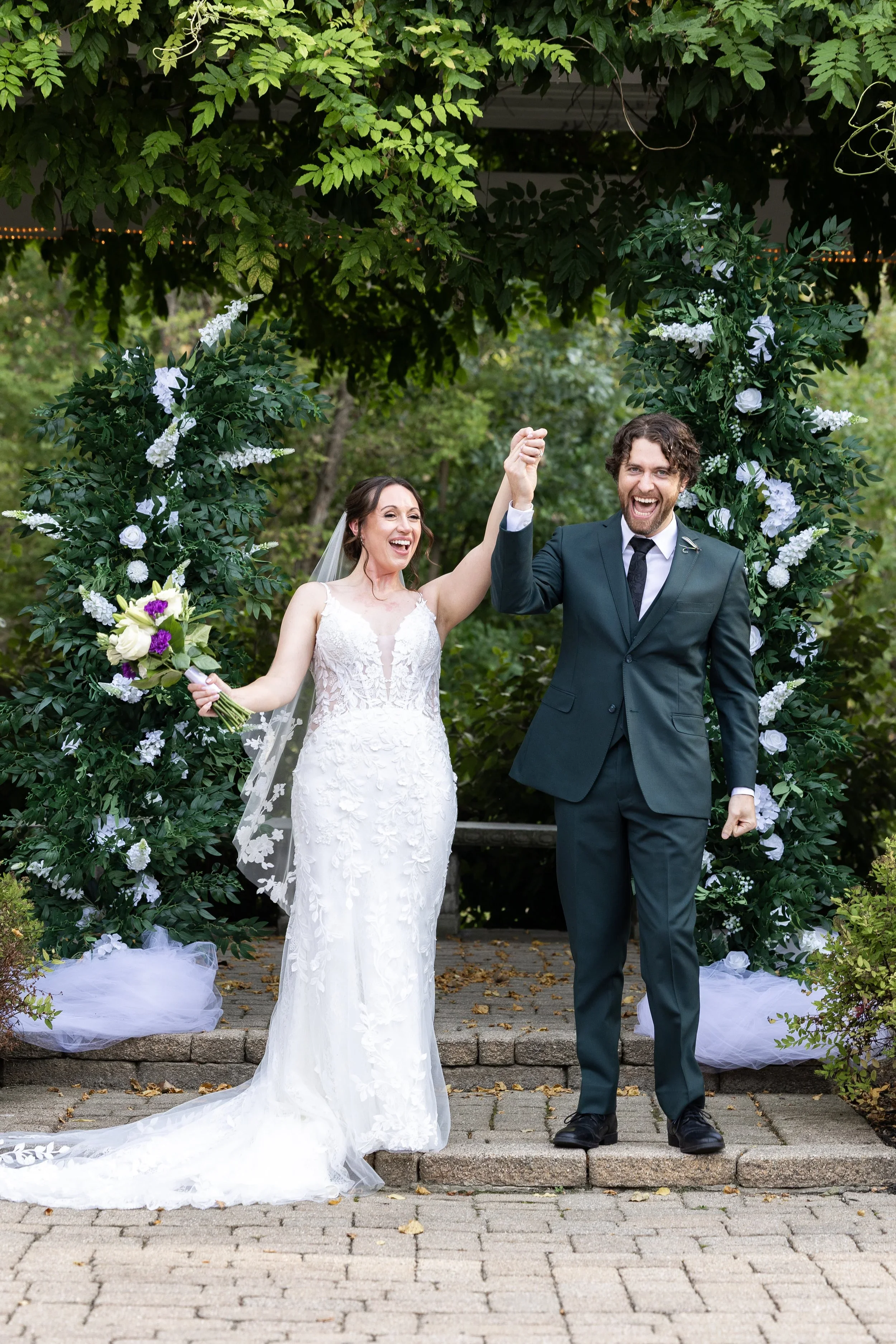 Bride and groom smiling after ceremony at wellers weddings in saline michigan