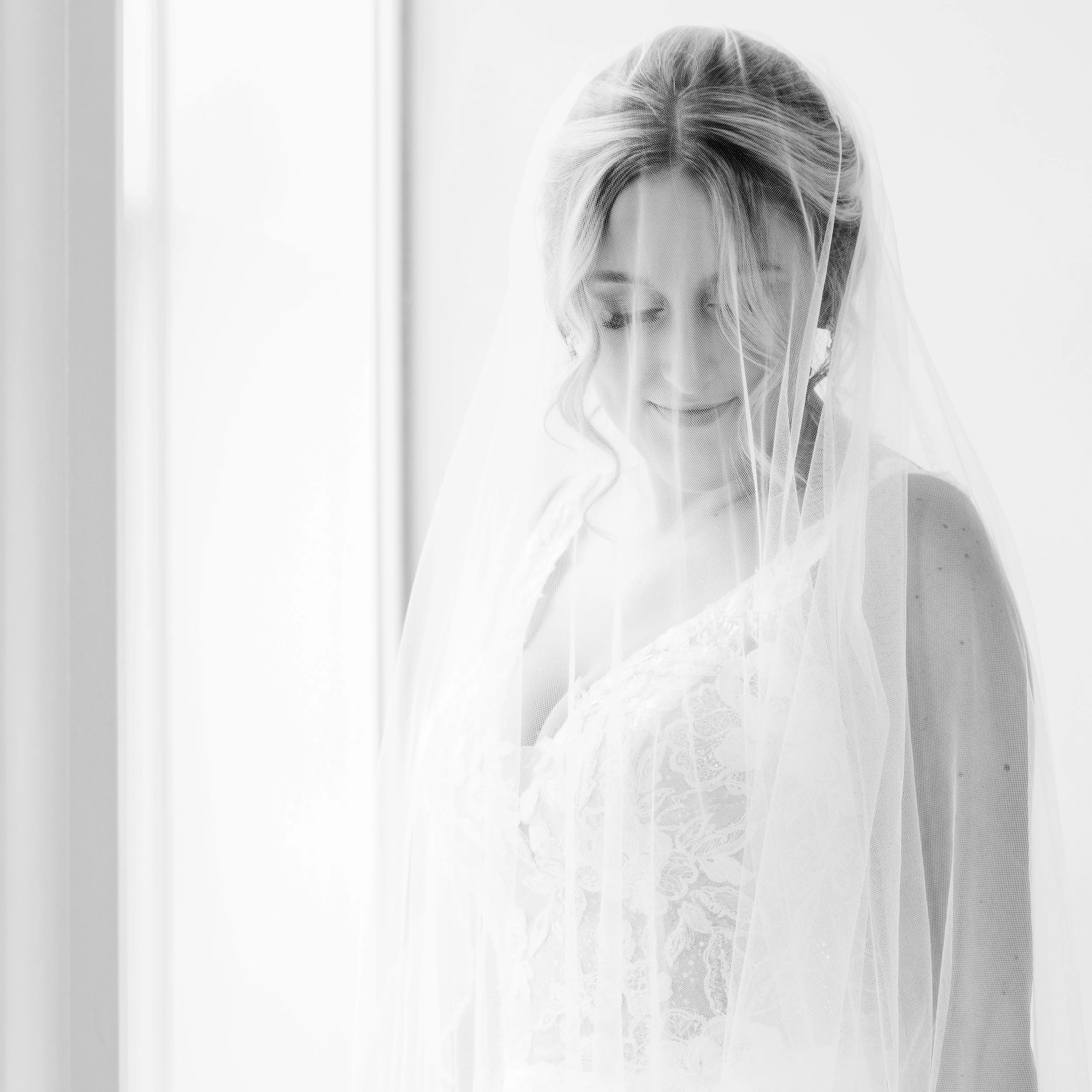 Black and white natural light bridal portrait of a bride before her Michigan wedding