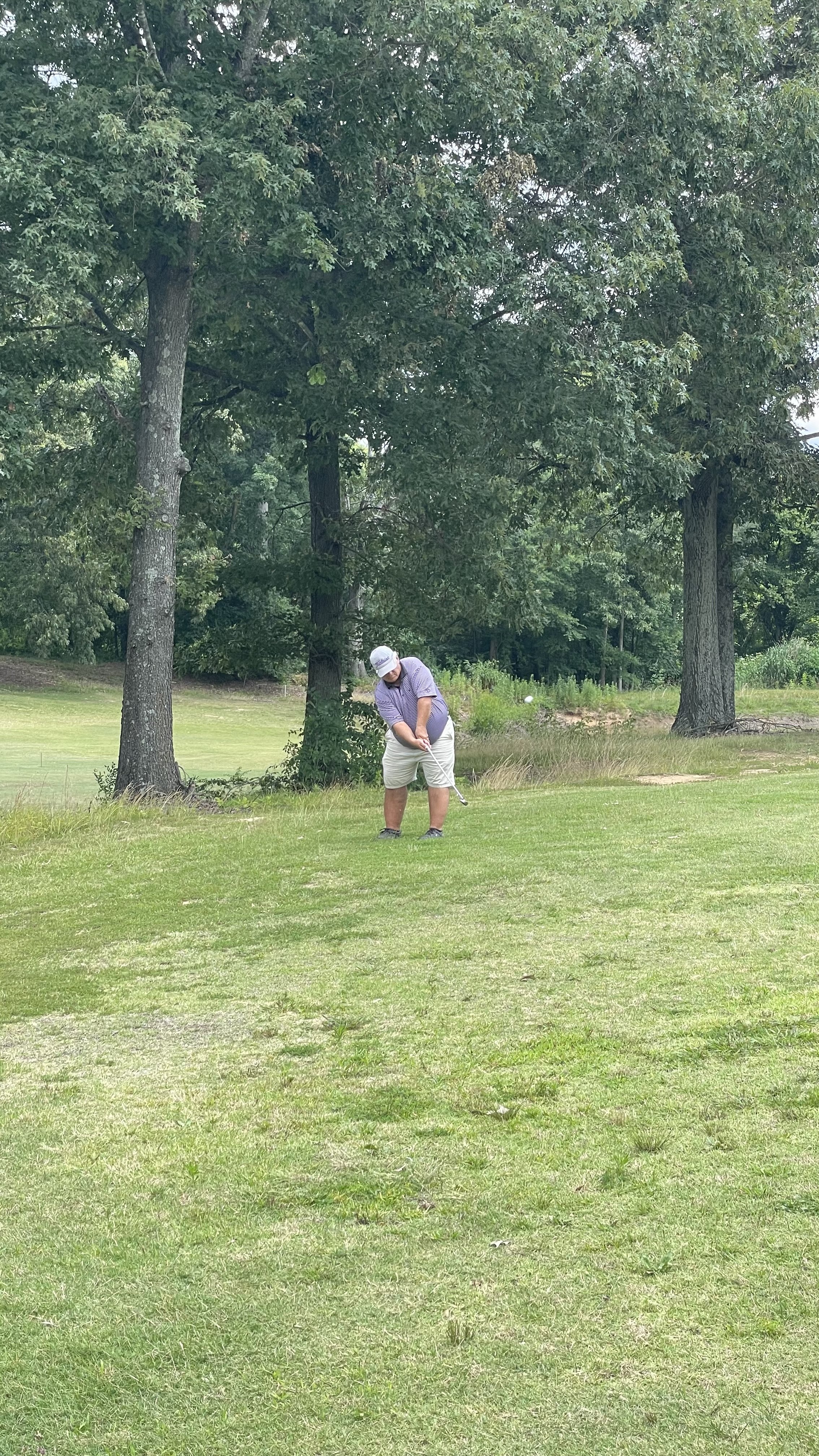 A golfer taking a shot.